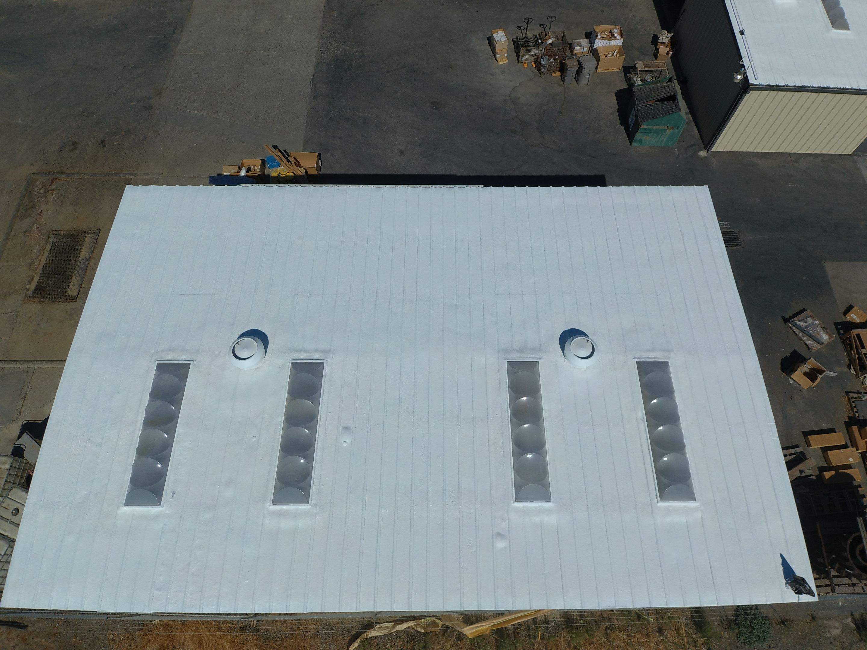 Spray foam and coatings using Conklin Benchmark/PUMA XL coatings and spray foam by Straight Edge Roofing Inc