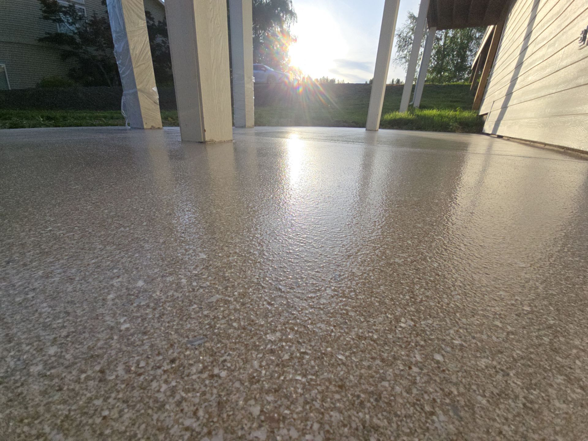 Patio Transformation with Sandstone Penntek Flooring by Croc Coatings, LLC