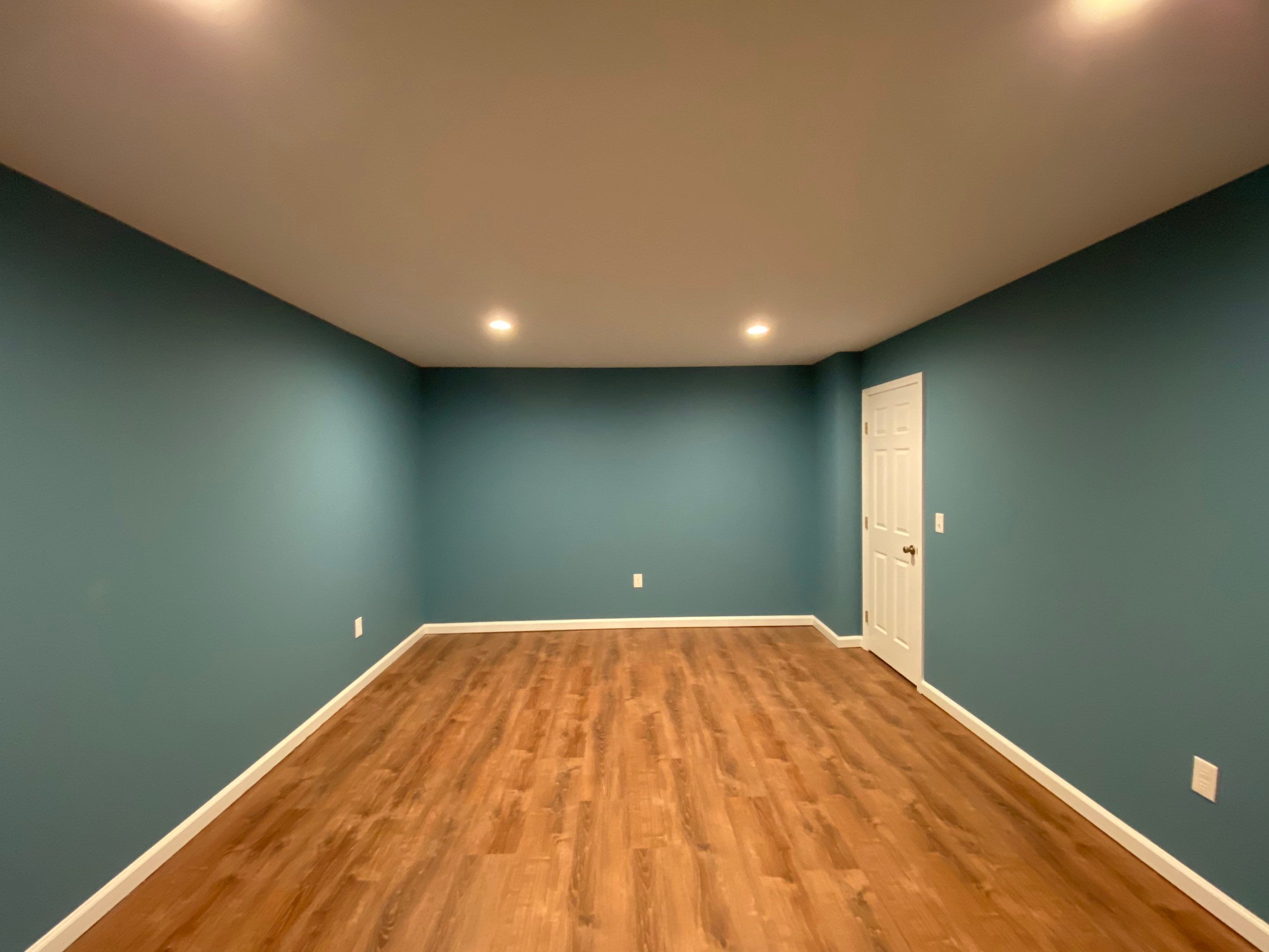 Finished Basement Transformation With Luxury Vinyl Plank Flooring in Acworth by Swift Home Renovations