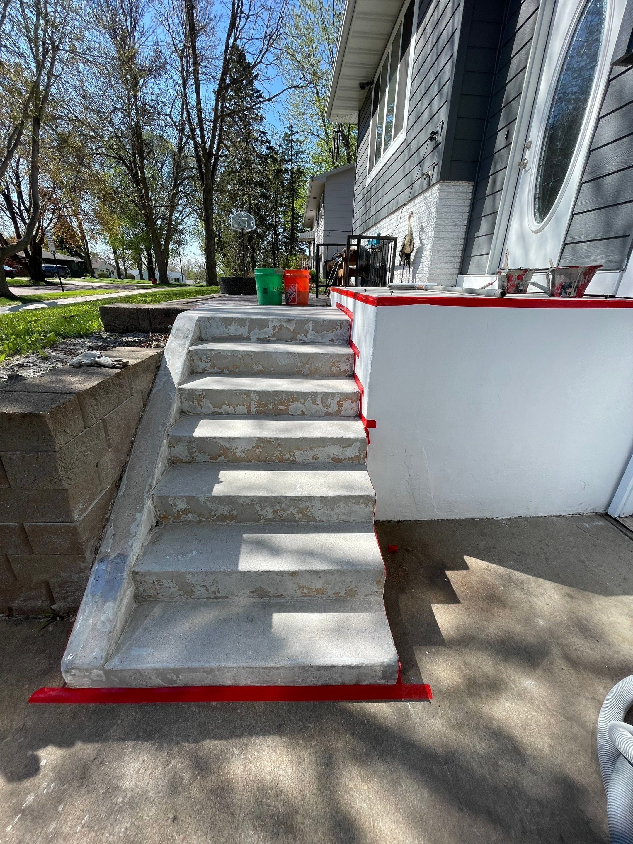 Grey Polyaspartic Porch and Stair Resurfacing in Sioux Falls by Select Painting, Coatings & Garage Cabinets