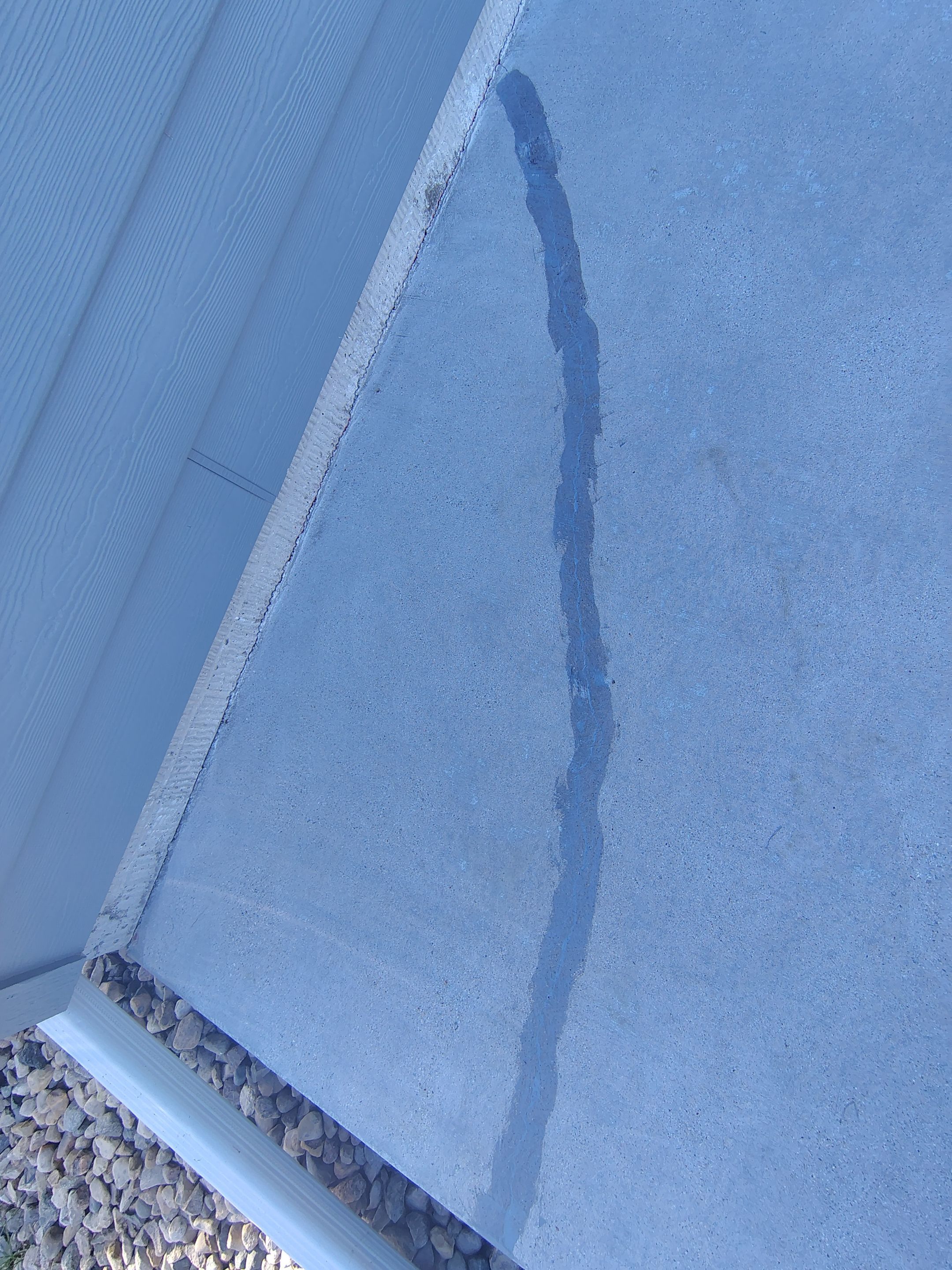 Speckled Concrete Patio Coating Installation in Sioux Falls by Select Painting, Coatings & Garage Cabinets
