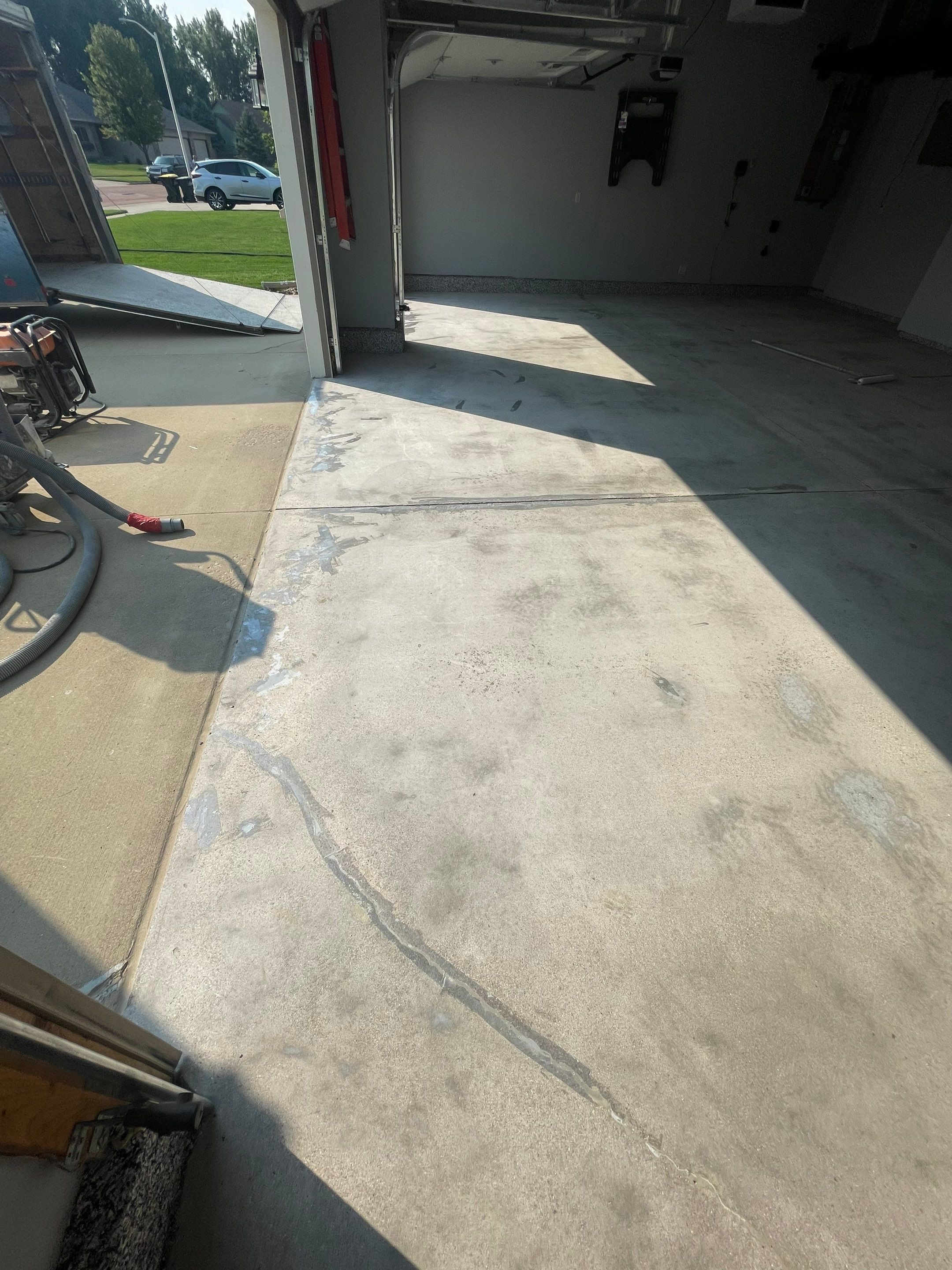 Sioux Falls Garage Concrete Coating Installation with Domino Flake by Select Painting, Coatings & Garage Cabinets