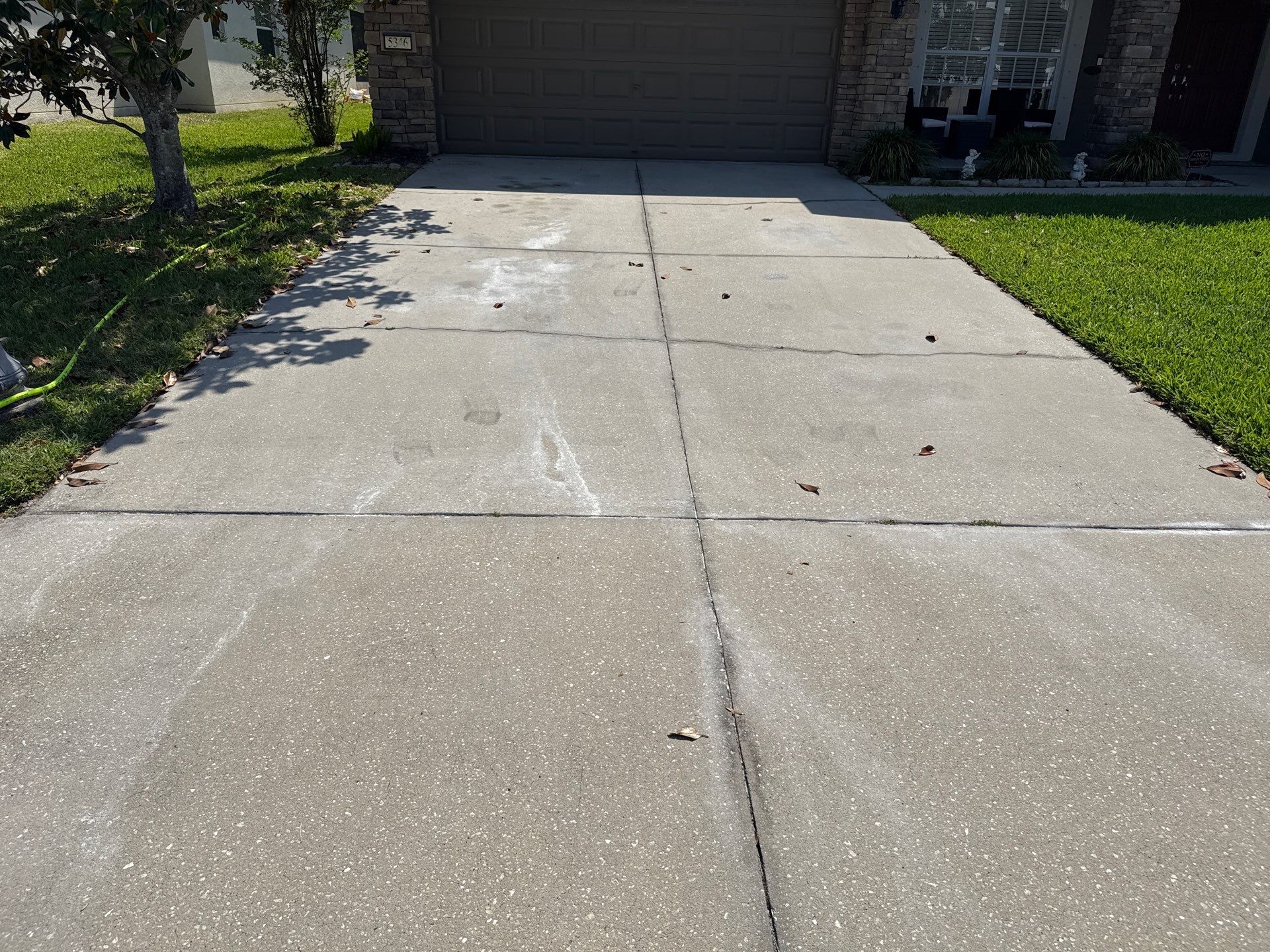 Concrete Driveway Oil Stain Removal | Harrison Ranch Community | Parrish, FL by Sunshine AquaWash