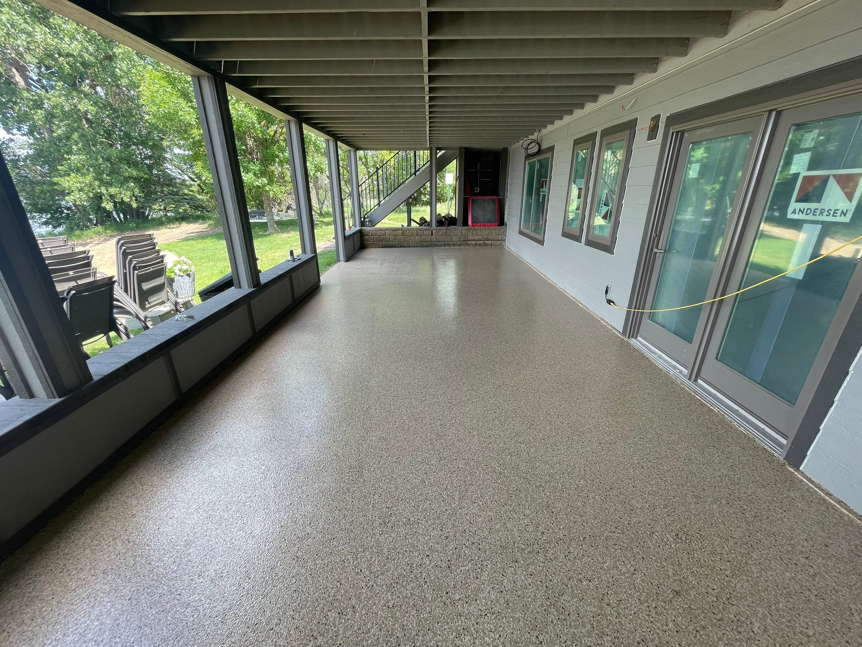 Lakefront Screened Patio Concrete Coating Installation in Wentworth by Select Painting, Coatings & Garage Cabinets