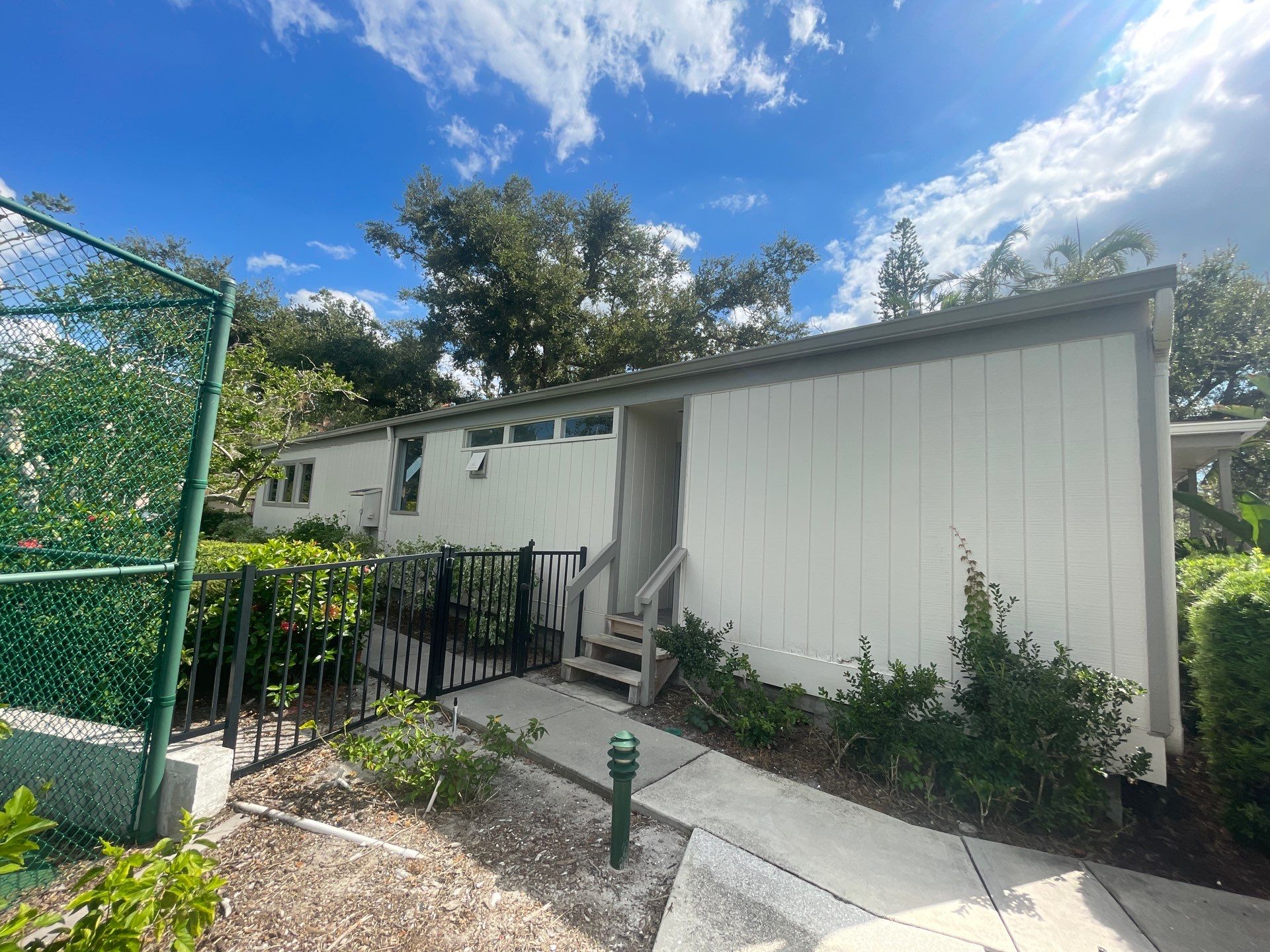 Clean Gutters and Roof in Sarasota FL by Gutter Professors