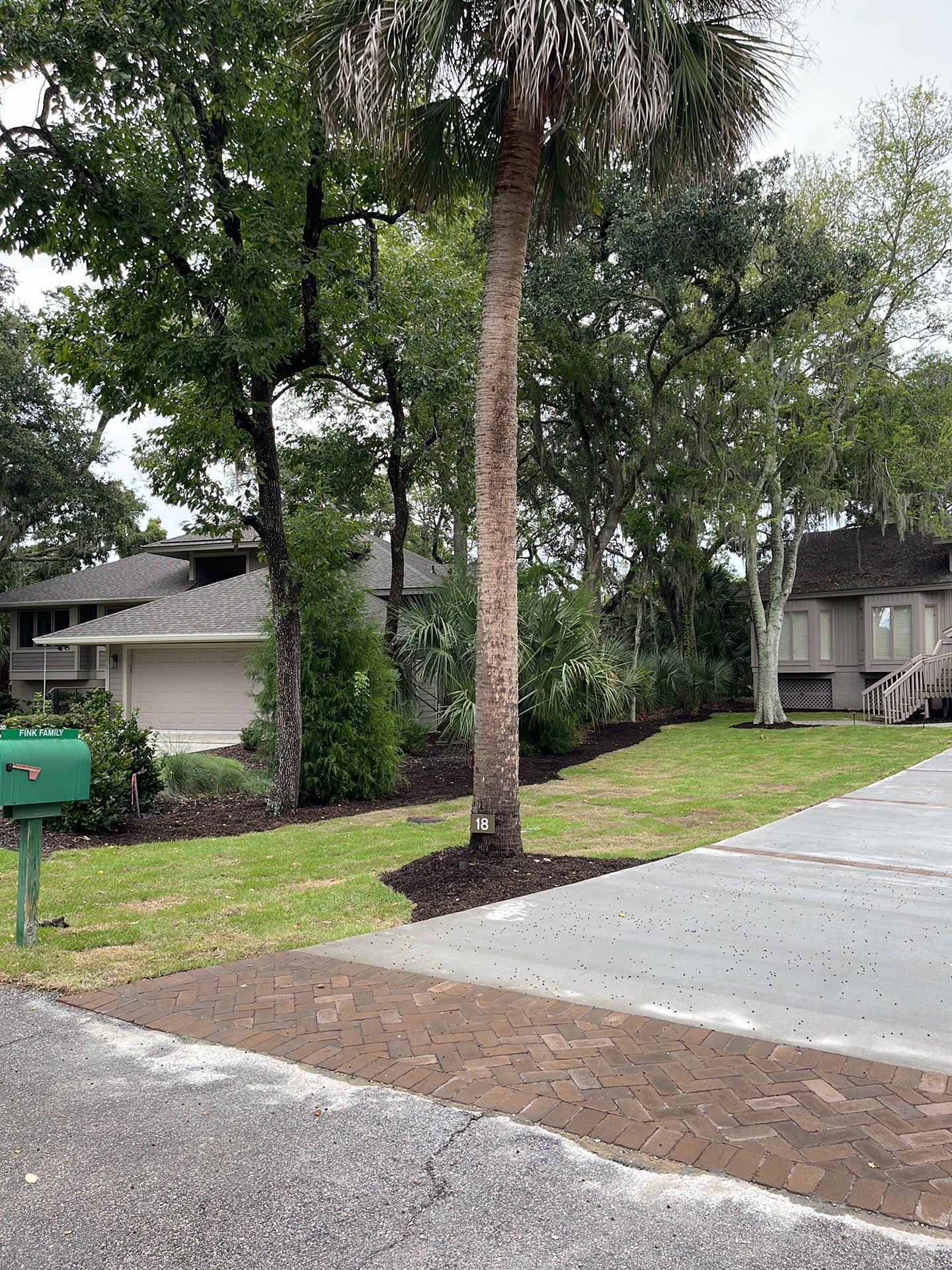 Concrete Driveway Replacement with Brick Paver Accents in Hilton Head Island by Lowcountry Scapes, LLC