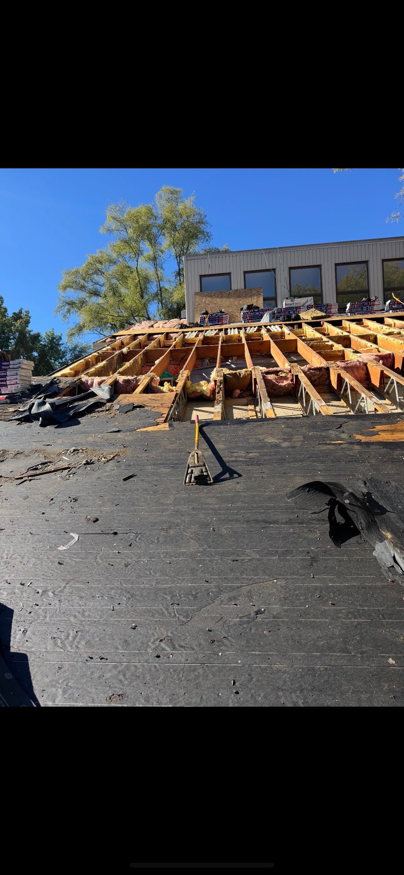 New Shingle Roof with Metal roof accents by Bloomfield Construction & Restoration