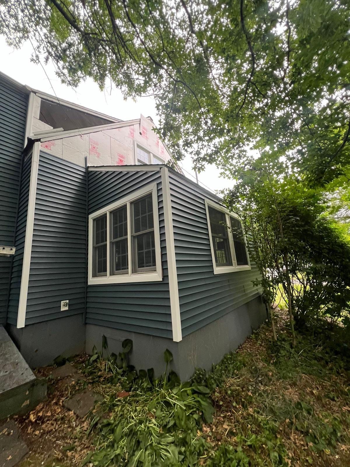 Complete Exterior Estate gray with Pacific Blue Siding by A Plus Exterior