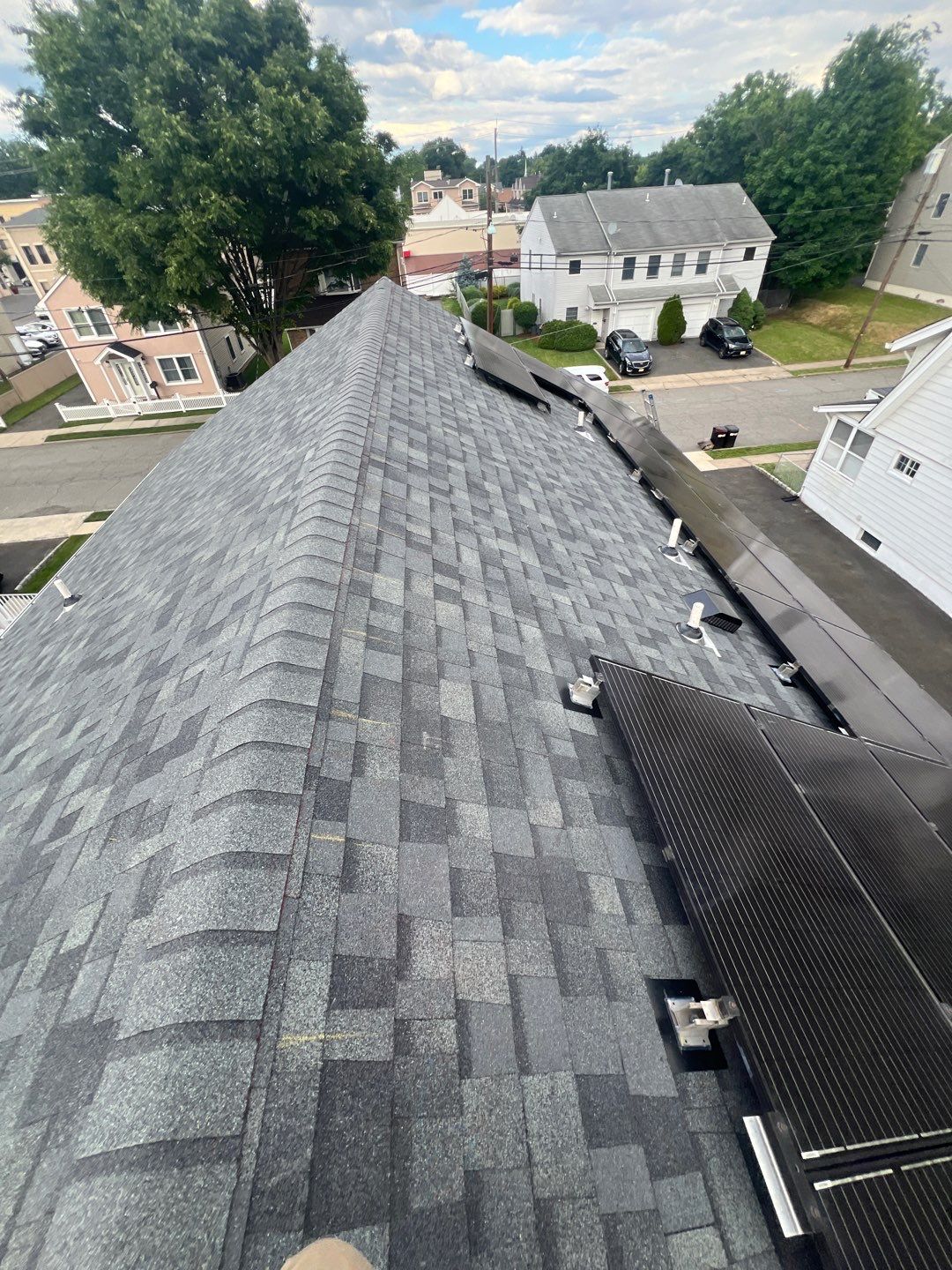 Charcoal Shingles by Reimagine Roofing