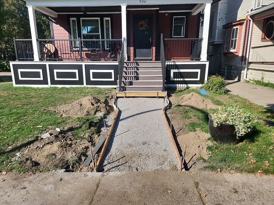 Exterior Renovations- Siding, Stamped Concrete, Porch, and Railings by Ivy Lea Construction