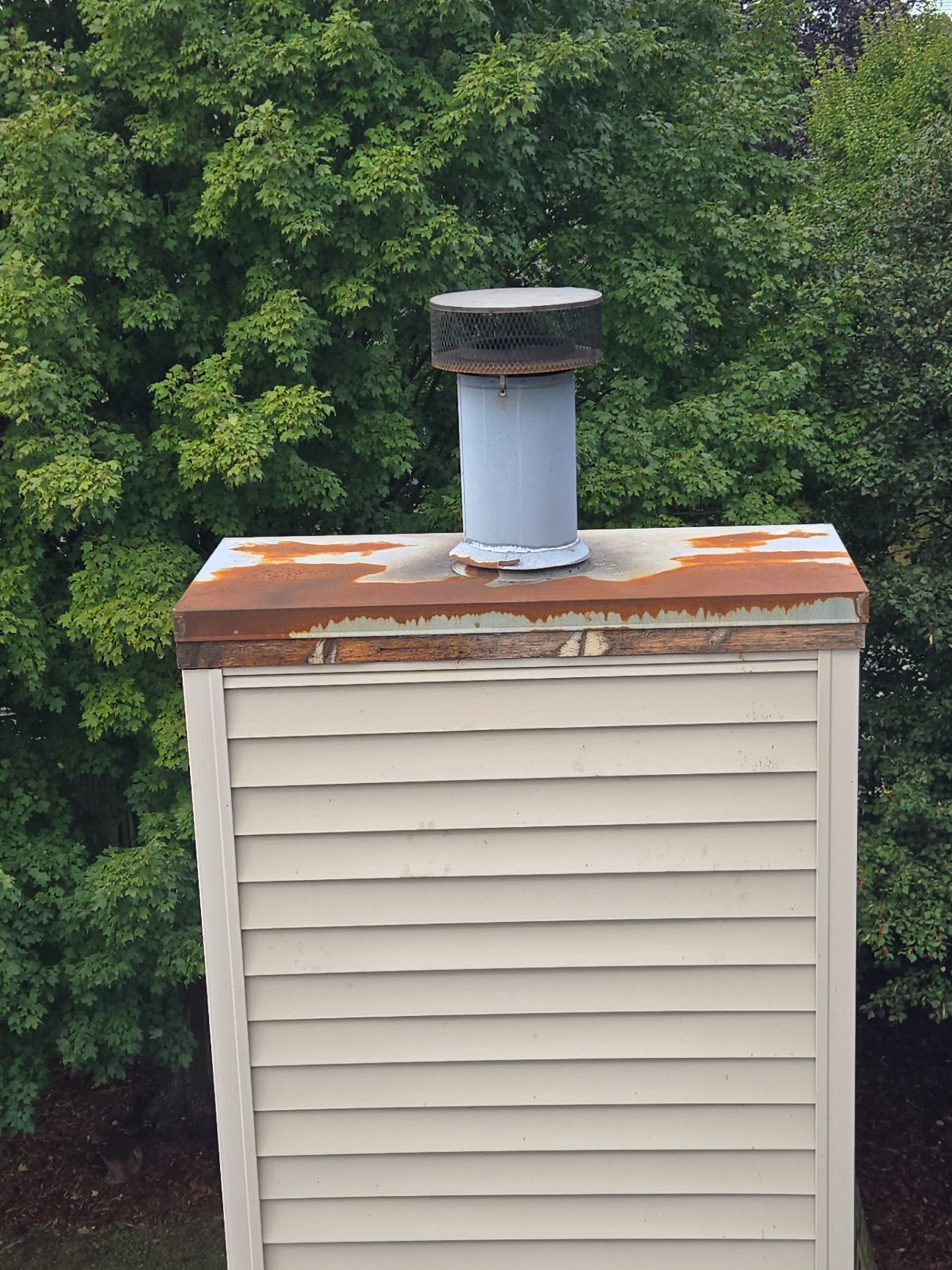 Rusted Chase Cover Replacement by Leonard and Sons Building Services, Inc.