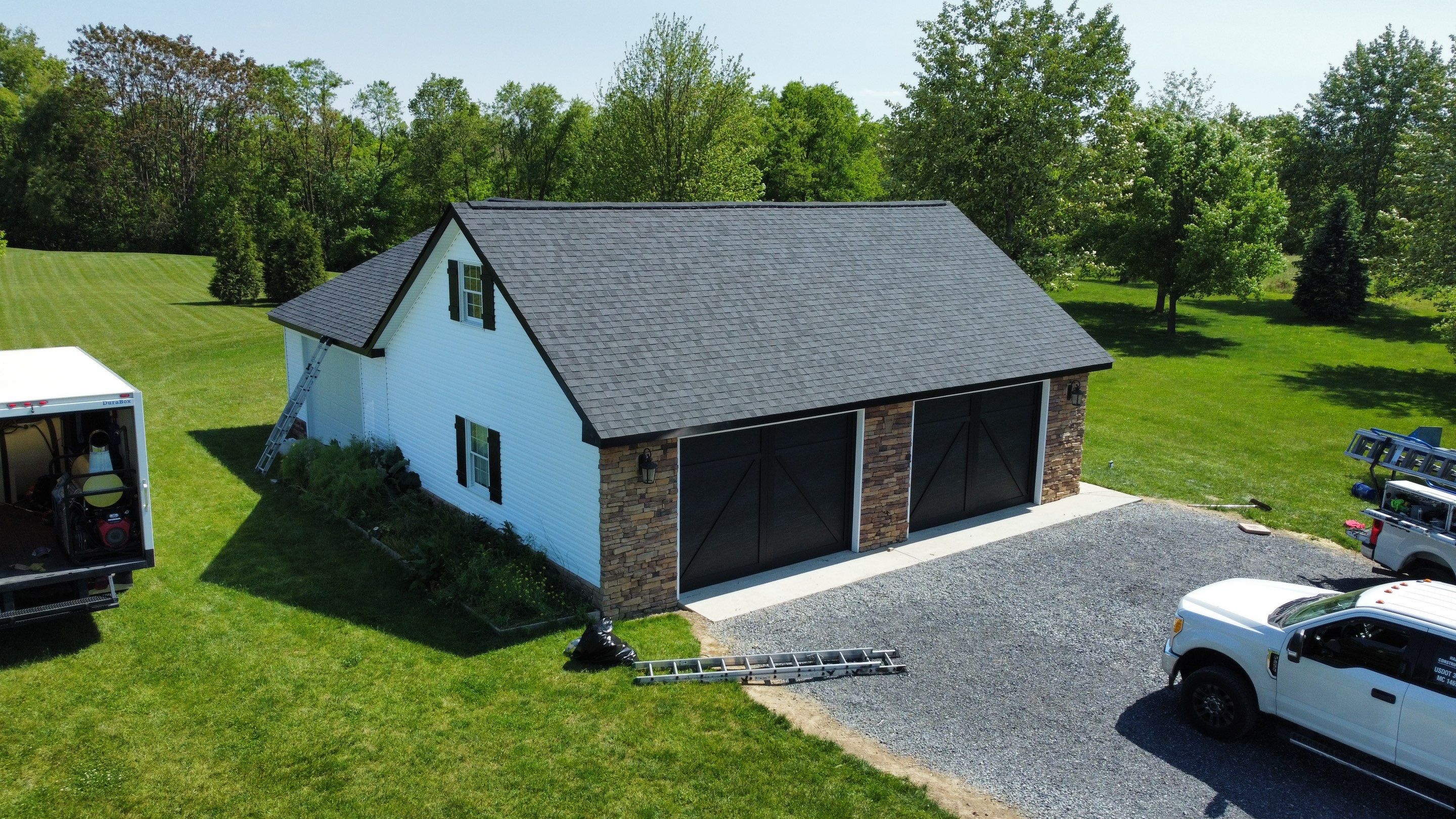 Roof Damage using Certainteed Lifetime Roofing System- Moire Black Landmark Pro shingkes with shadow ridge caps. by BulletpROOF Exteriors