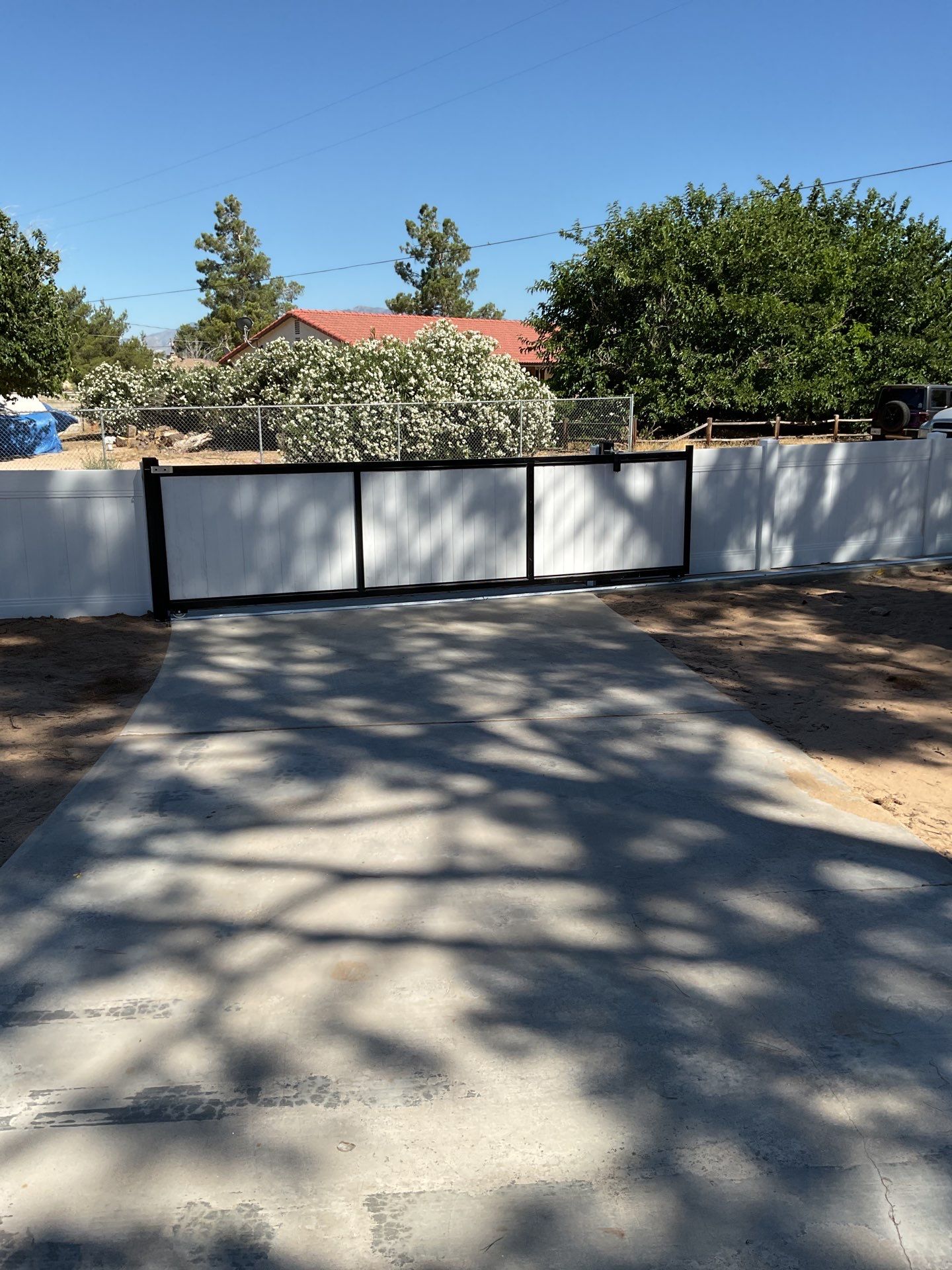 4ft White Vinyl Fence with Solar Power Motorized Gate by Fence Guys Inc.