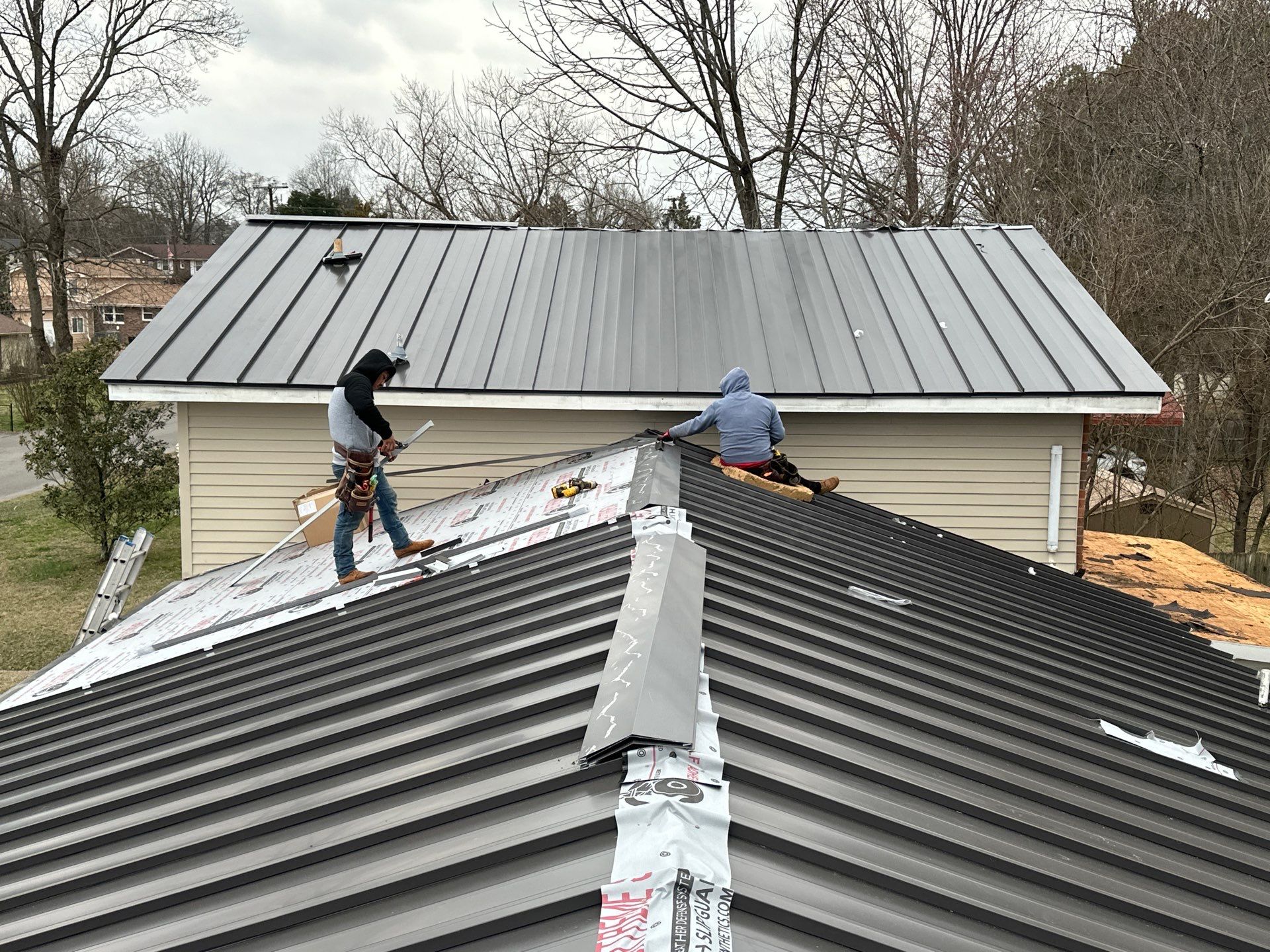 Residential Roofing Installation using Standing Seam Metal by Undersun Roofing 