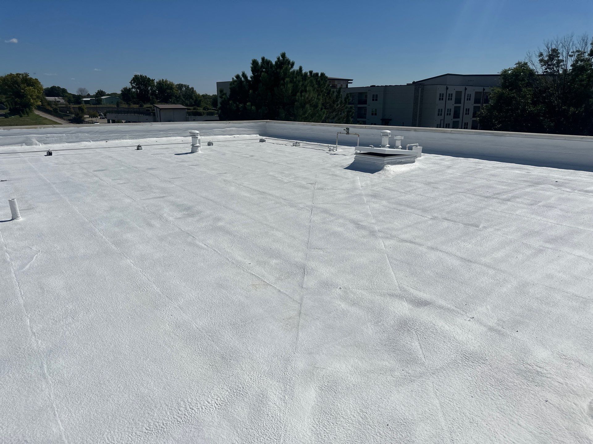 Commercial Roofing Install - SPF Foam & Coatings Restoration & EPDM System - Color White  by Titan Commercial & Residential Roofing 