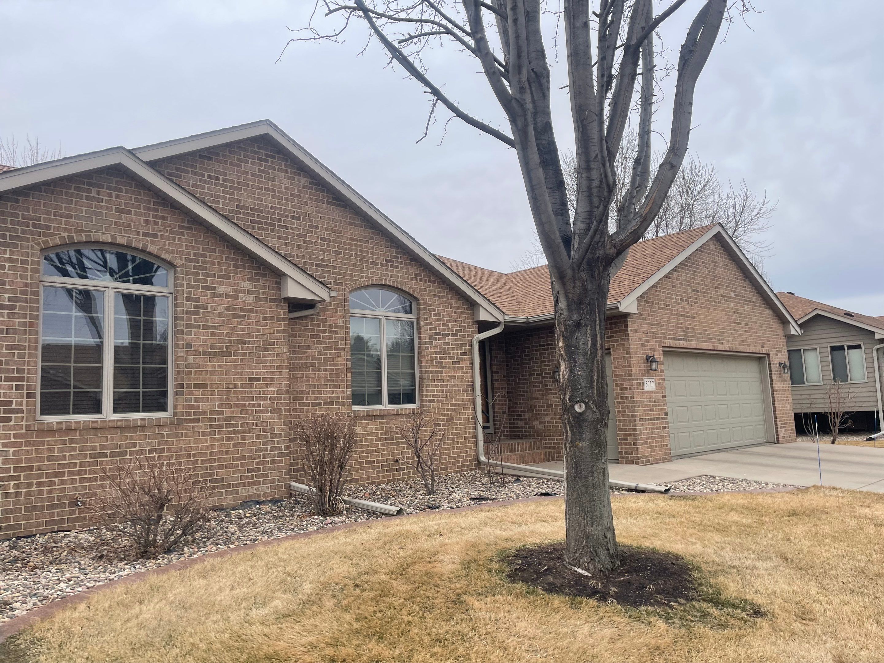Residential Exterior Siding and Trim Painting in Sioux Falls by Select Painting, Coatings & Garage Cabinets