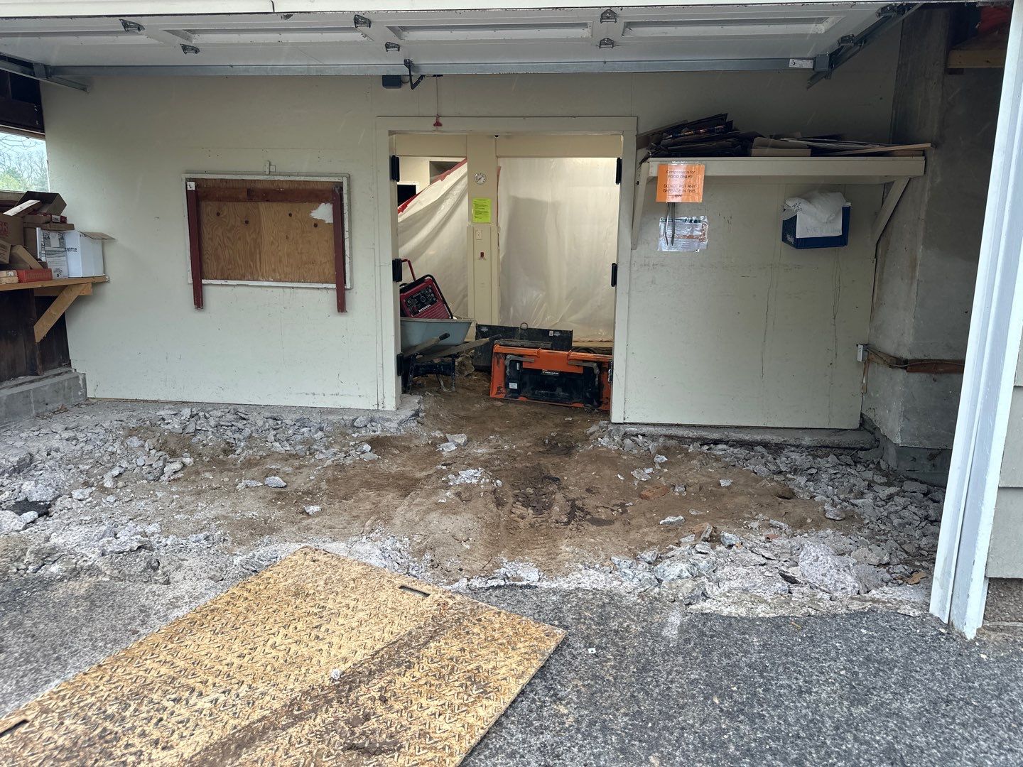 Concrete garage floor replacement with a broom finished apron  by NG Masonry & Construction LLC
