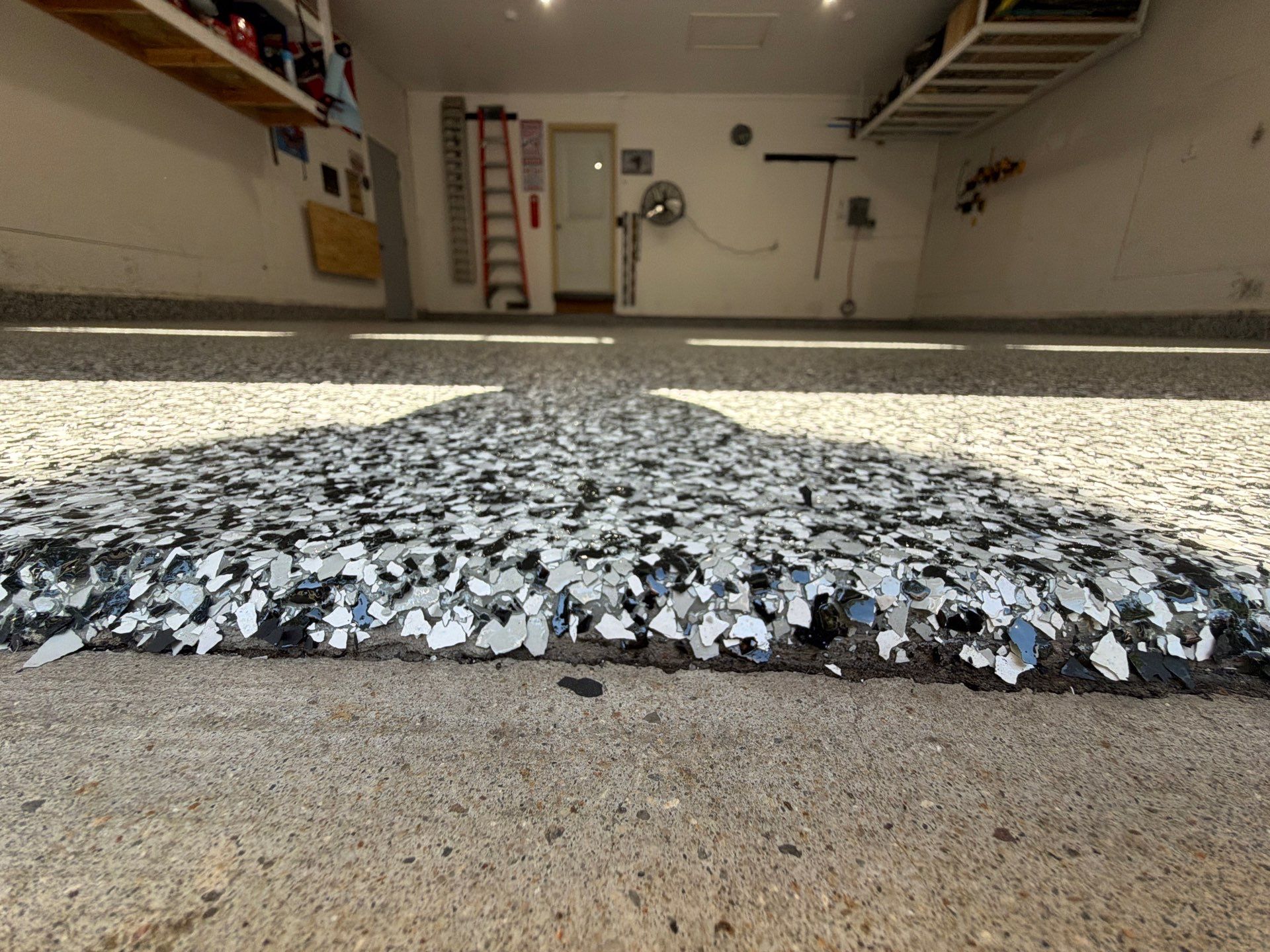 Custom Speckled Epoxy Garage Floor Coating in Fruitport, Michigan by Gordon Painting