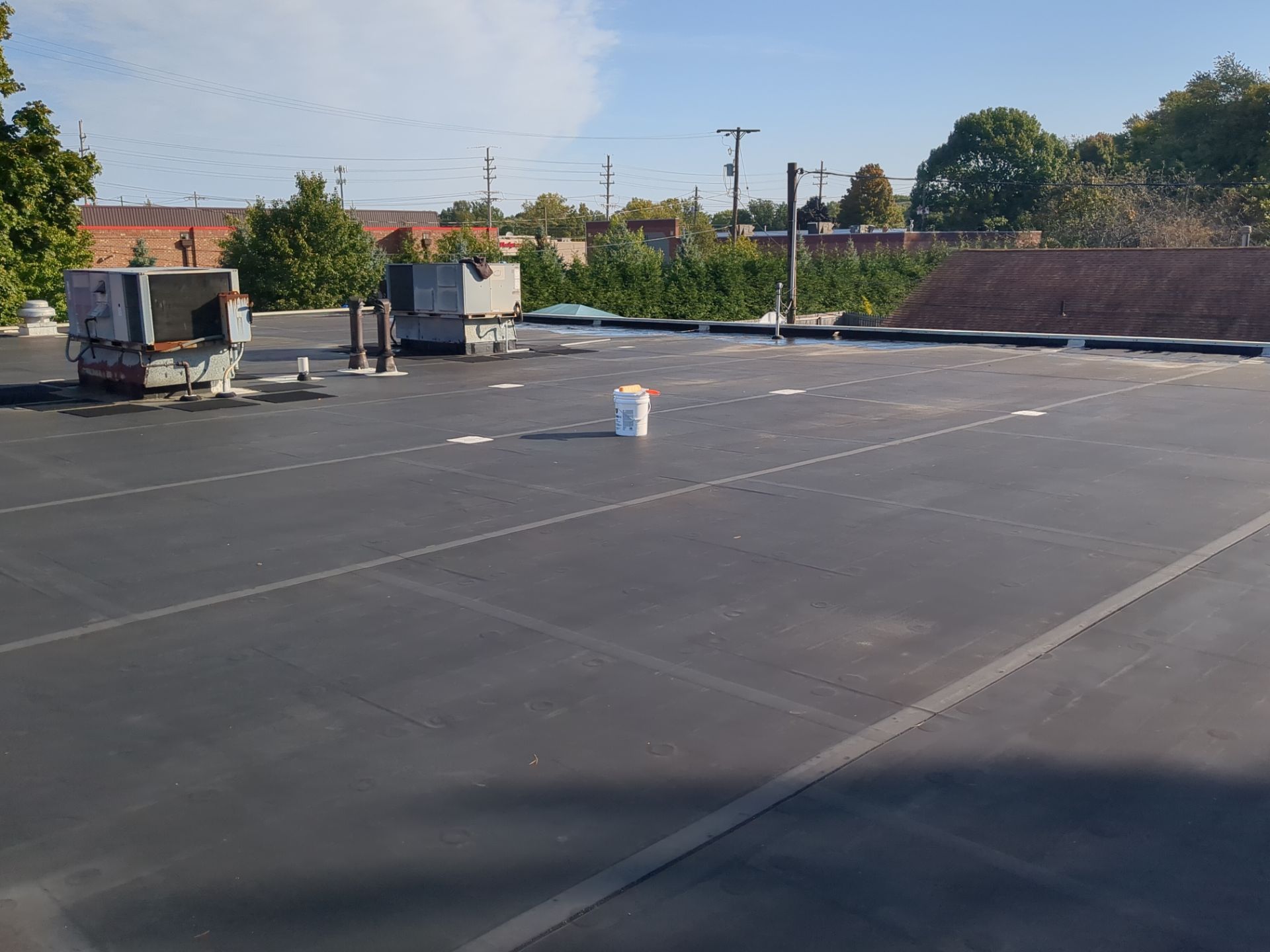 Commercial Roofing Repair using UniFlex Silicone Roof Coating on KinderCare Learning Center by 3 Daughters Construction 