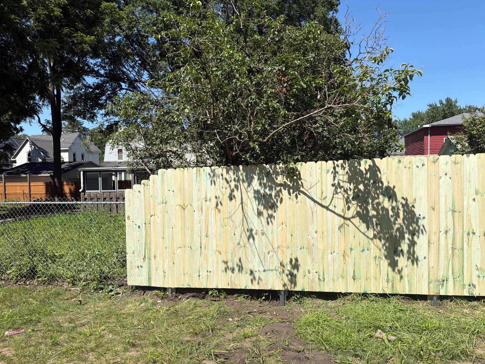 Pressure-Treated Wood Privacy Fence Installation in Waterloo by Perfect Picket Fence and Stain