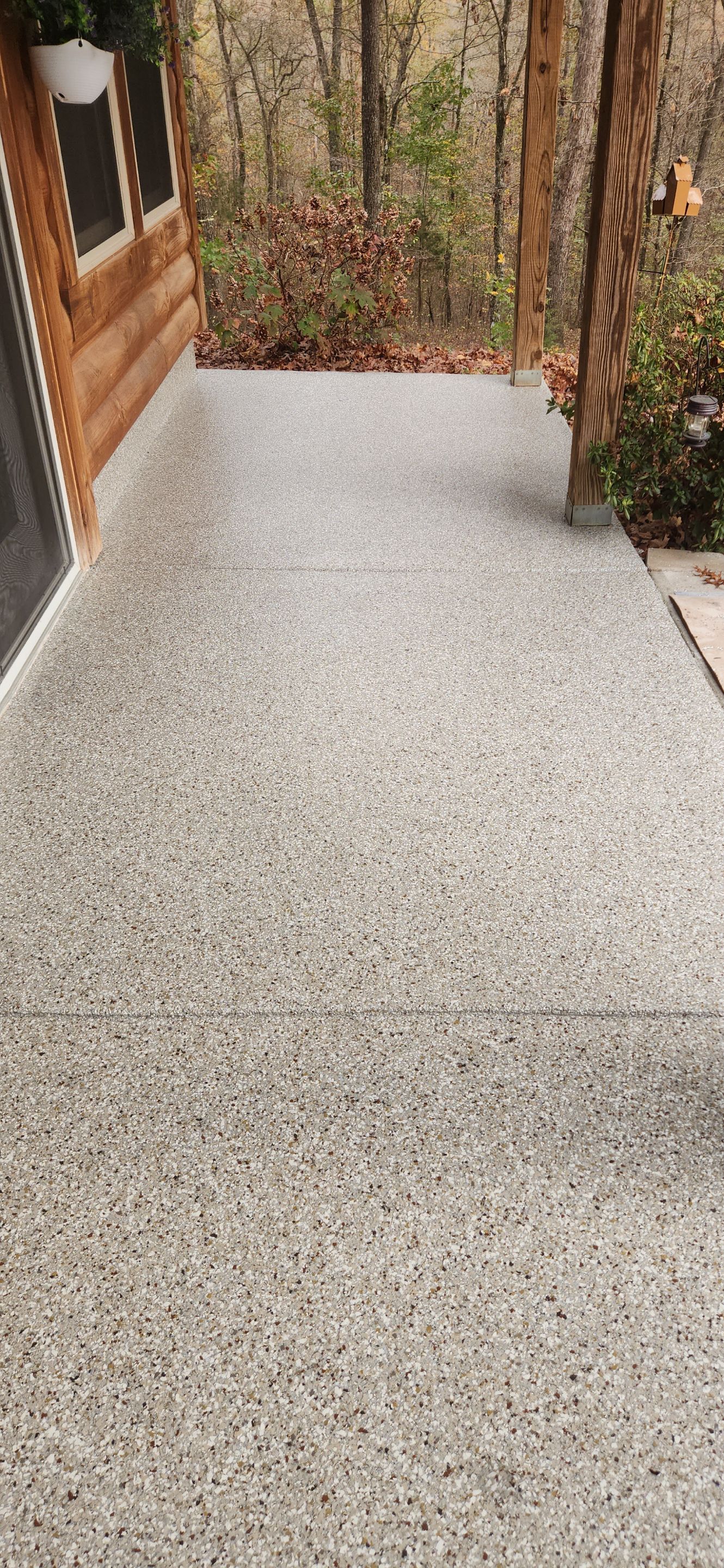 Front Porch and Garage using Creekbed by Elite Floor Solutions