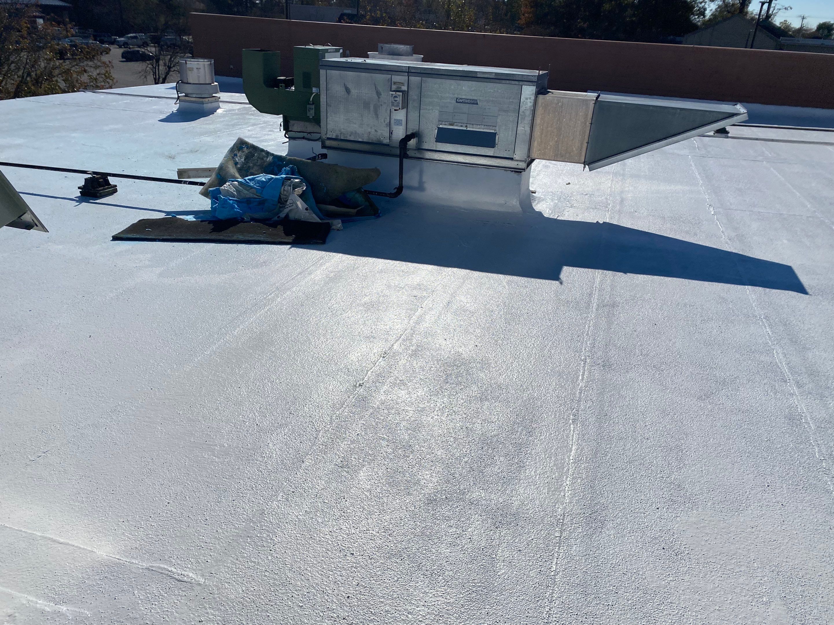 Commercial Coating using Poly Urerthane and Silicone Coating by Just In Time Roofing and Restoration