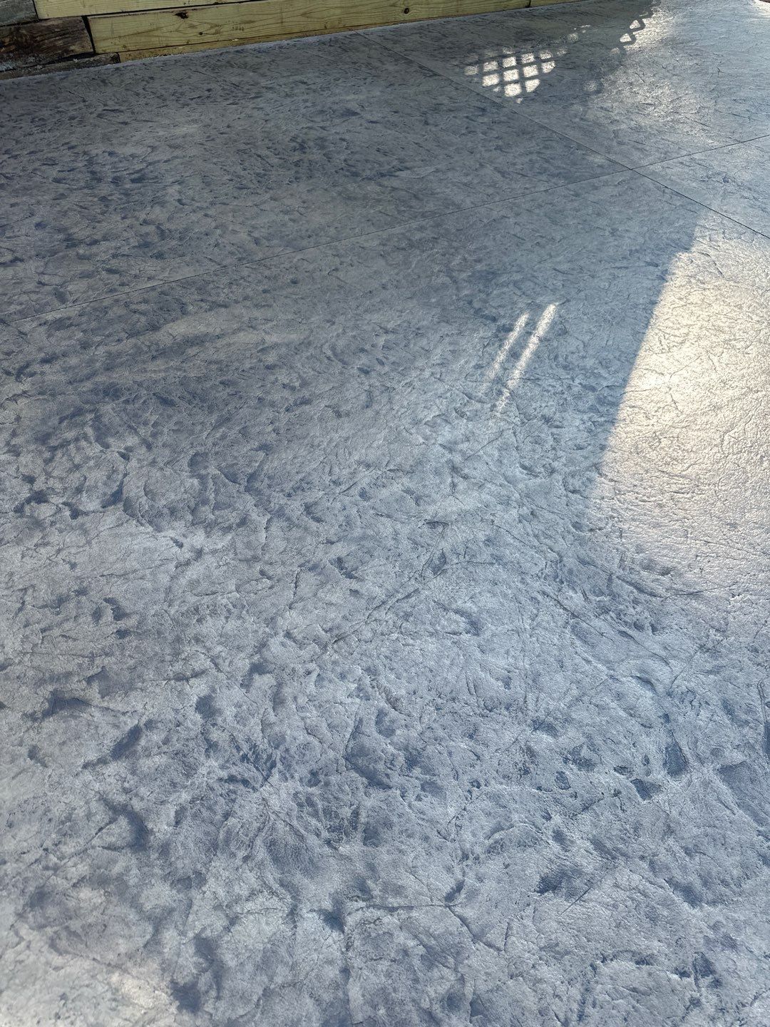 Rolled slate stamped patio  by NG Masonry & Construction LLC