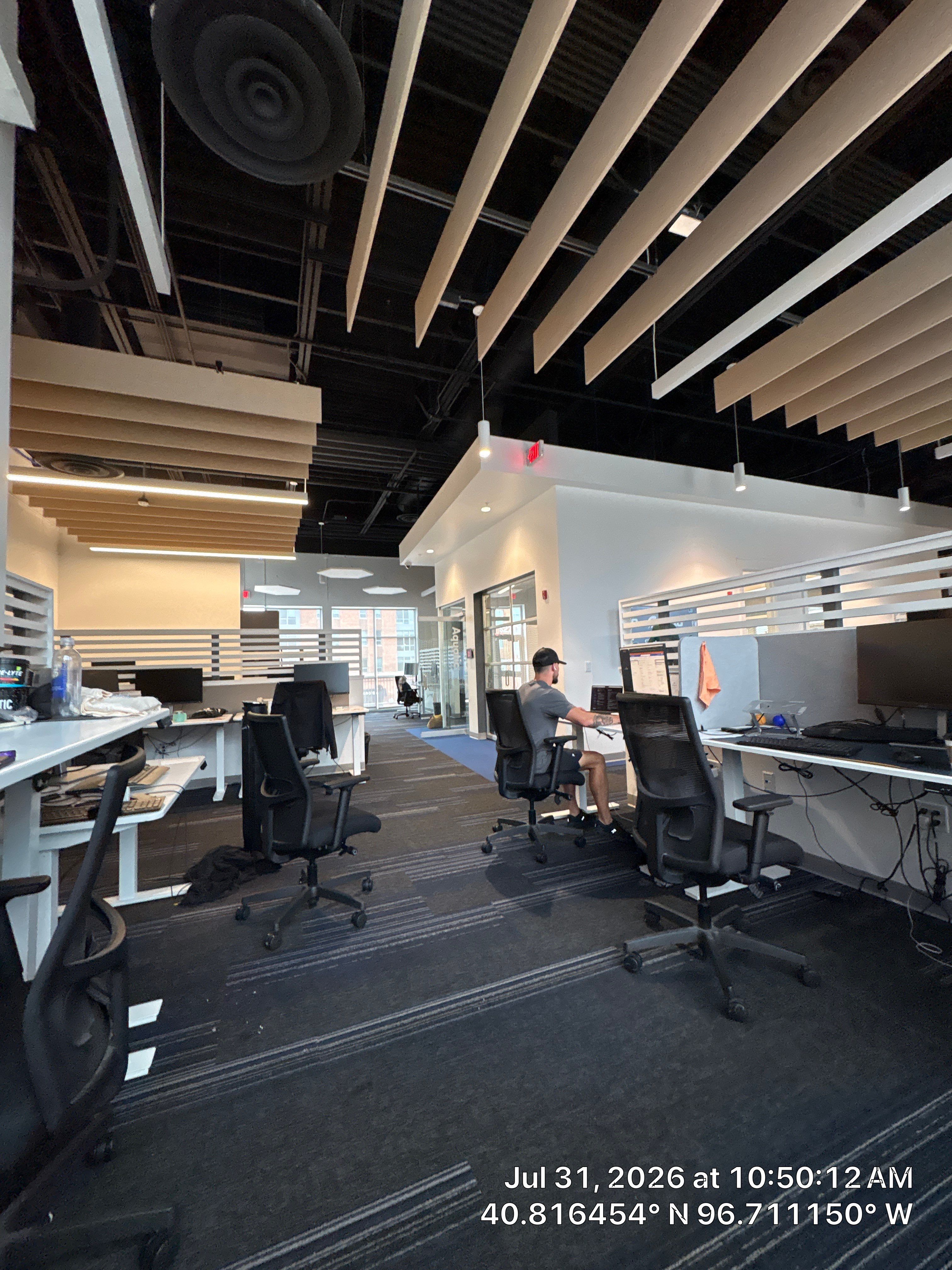 Modern Open-Plan Office Remodel with Acoustic Ceiling Baffles by CompanyCam Sales Demo