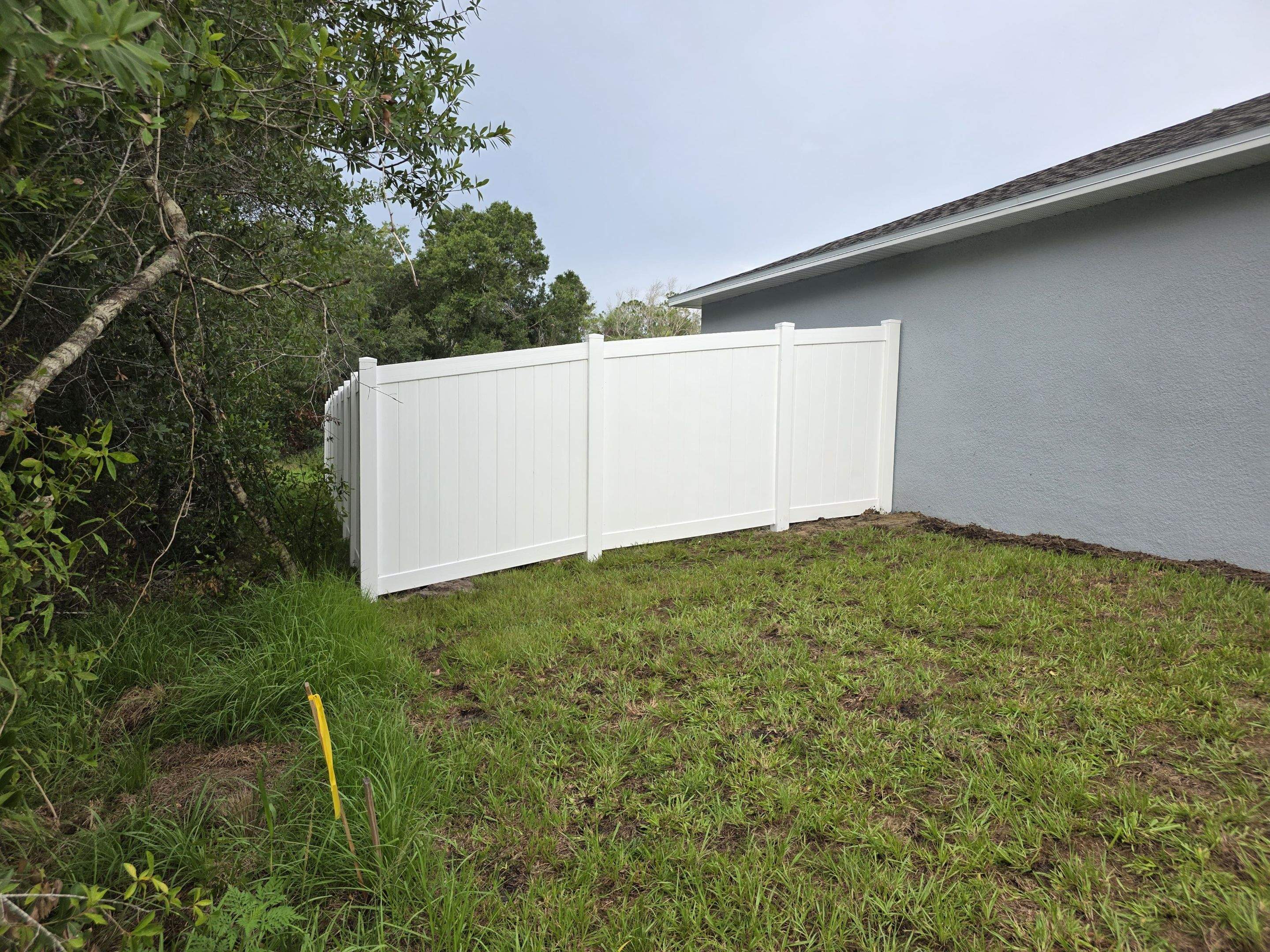 White Vinyl Privacy Fence with Gate Installation in North Port by True Fence LLC