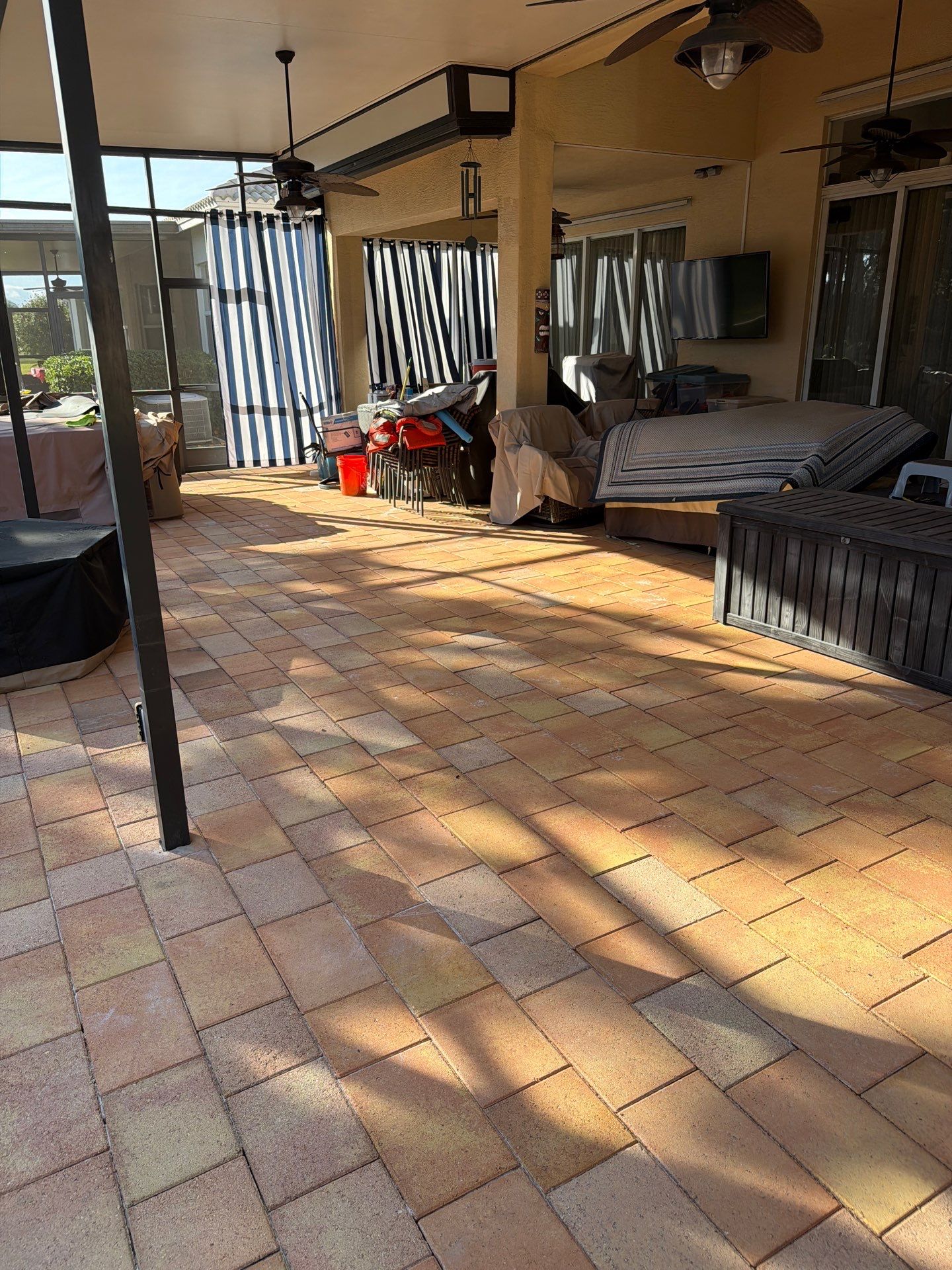 Paver Sealing for Herringbone Driveway and Screened Lanai in Valencia Lakes by Supreme Paver Experts