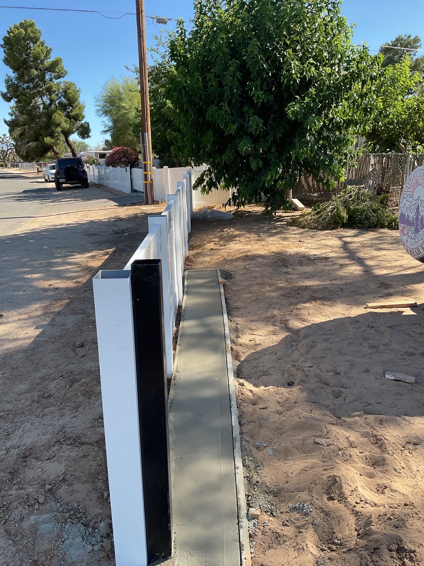 4ft White Vinyl Fence with Solar Power Motorized Gate by Fence Guys Inc.