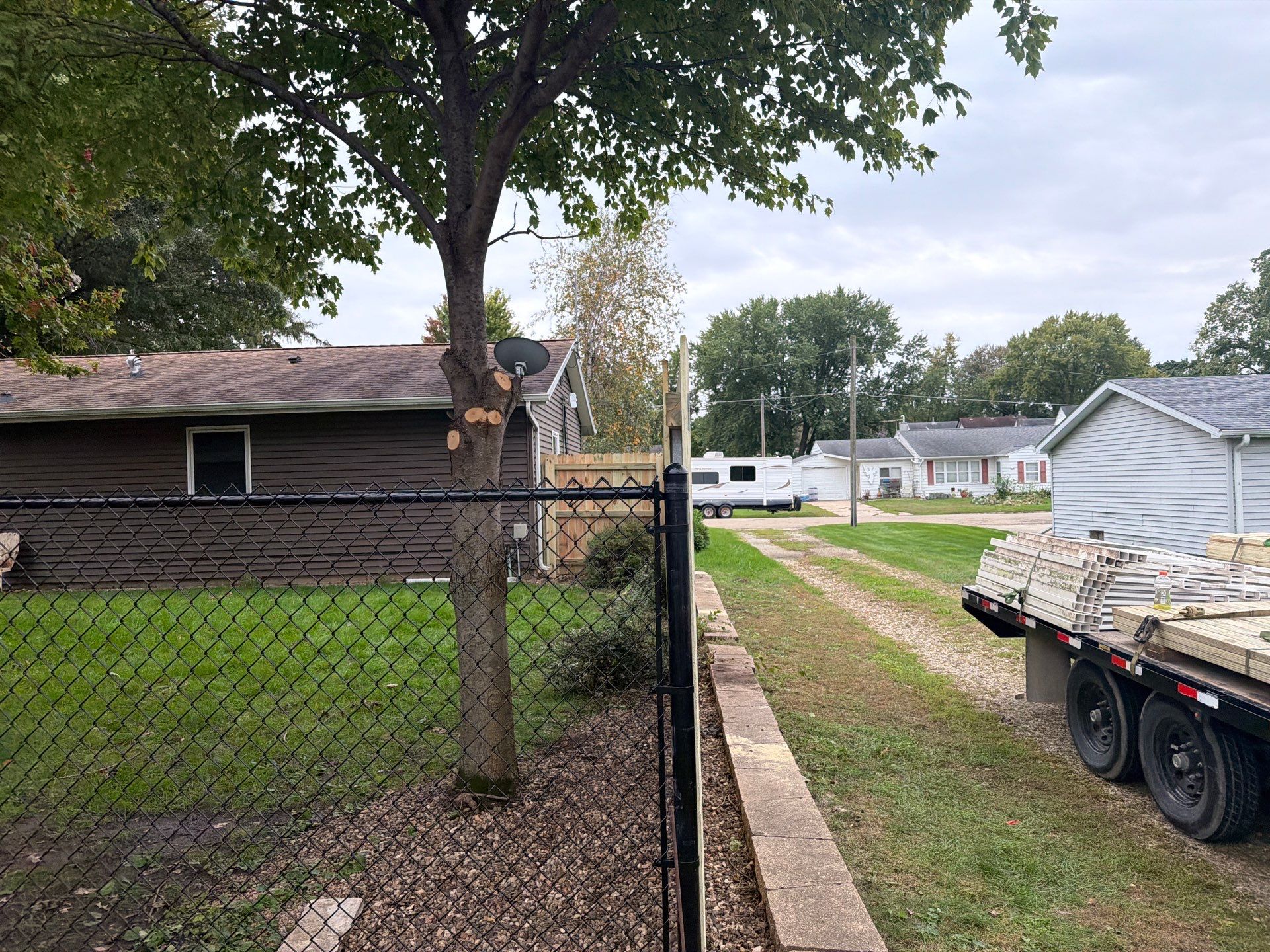 Custom Wood Privacy and Black Chain Link Fence in Hudson by Perfect Picket Fence and Stain