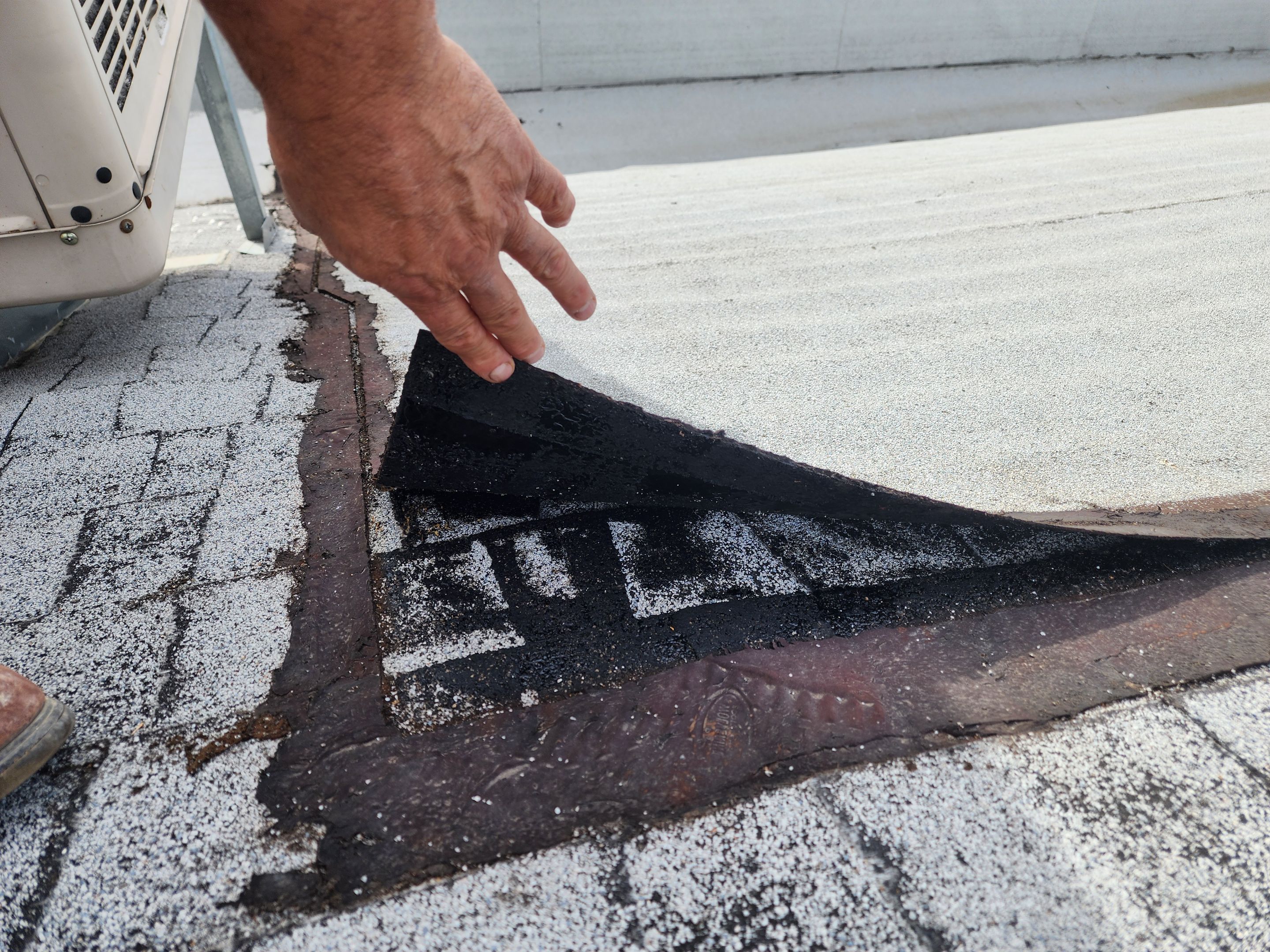 Foam and coatings on commercial roof by Straight Edge Roofing Inc