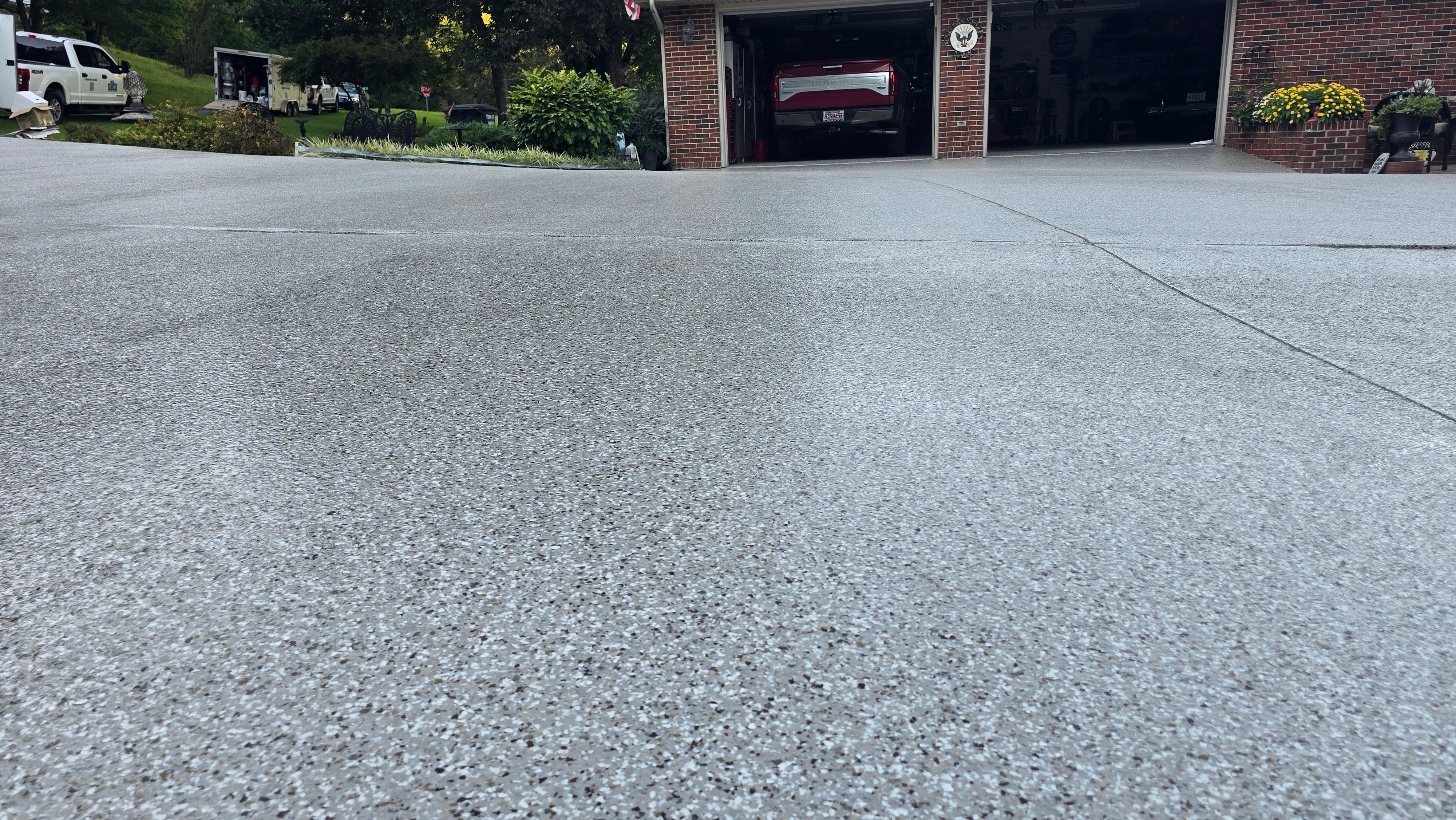 Driveway, Garage, Porch, and Sidewalk using Creekbed by Elite Floor Solutions
