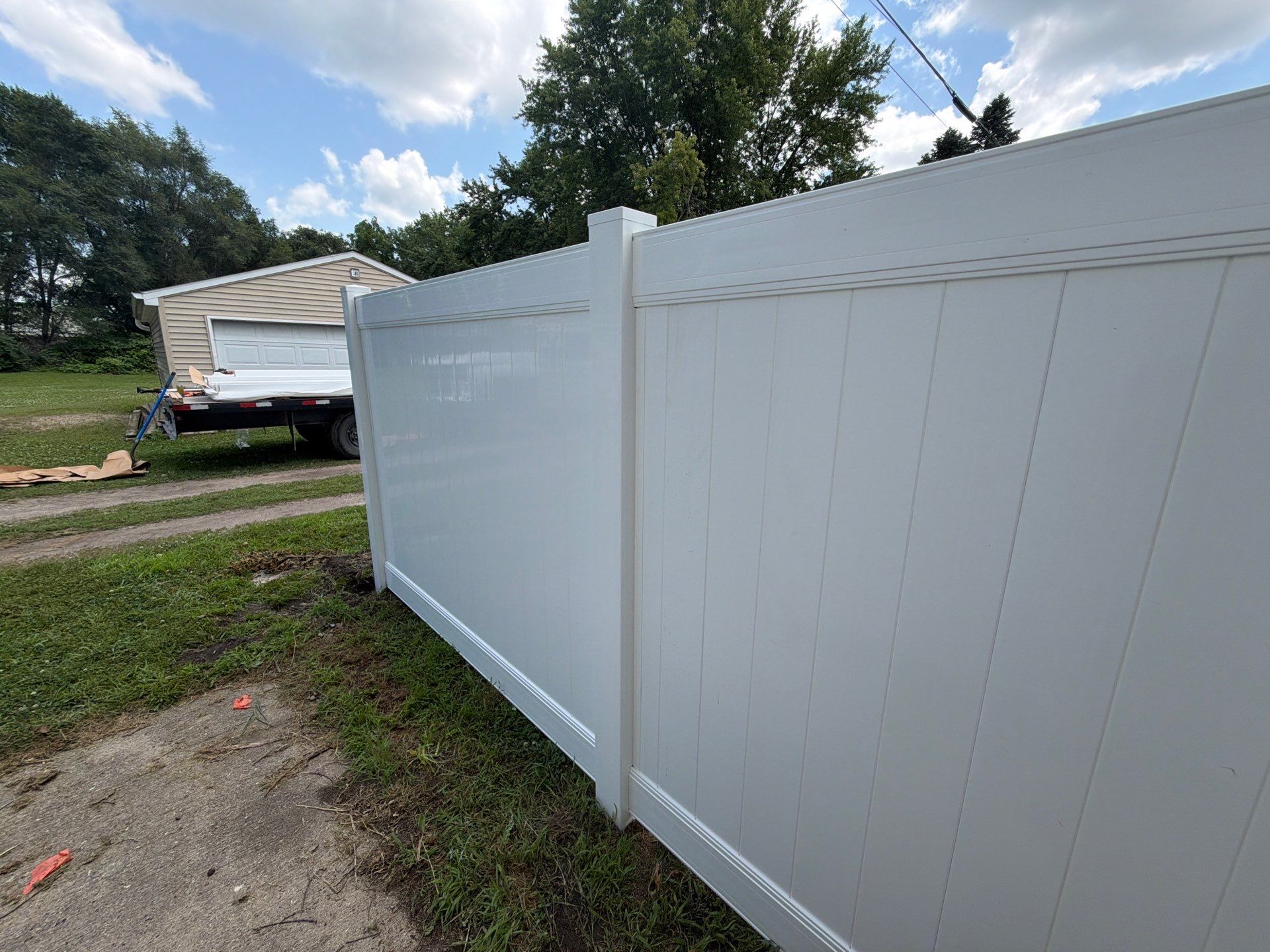 White Vinyl Privacy Fence Installation in Waterloo, Iowa by Perfect Picket Fence and Stain