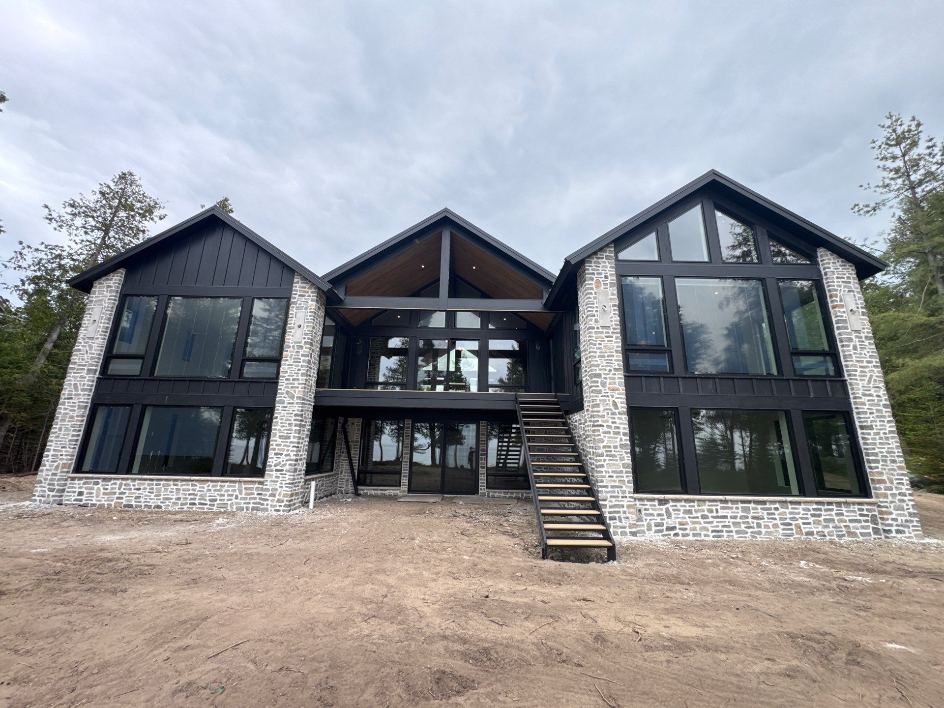 Gutter and Drainage System Installation for Modern Residential Build by Rainbow Seamless Systems