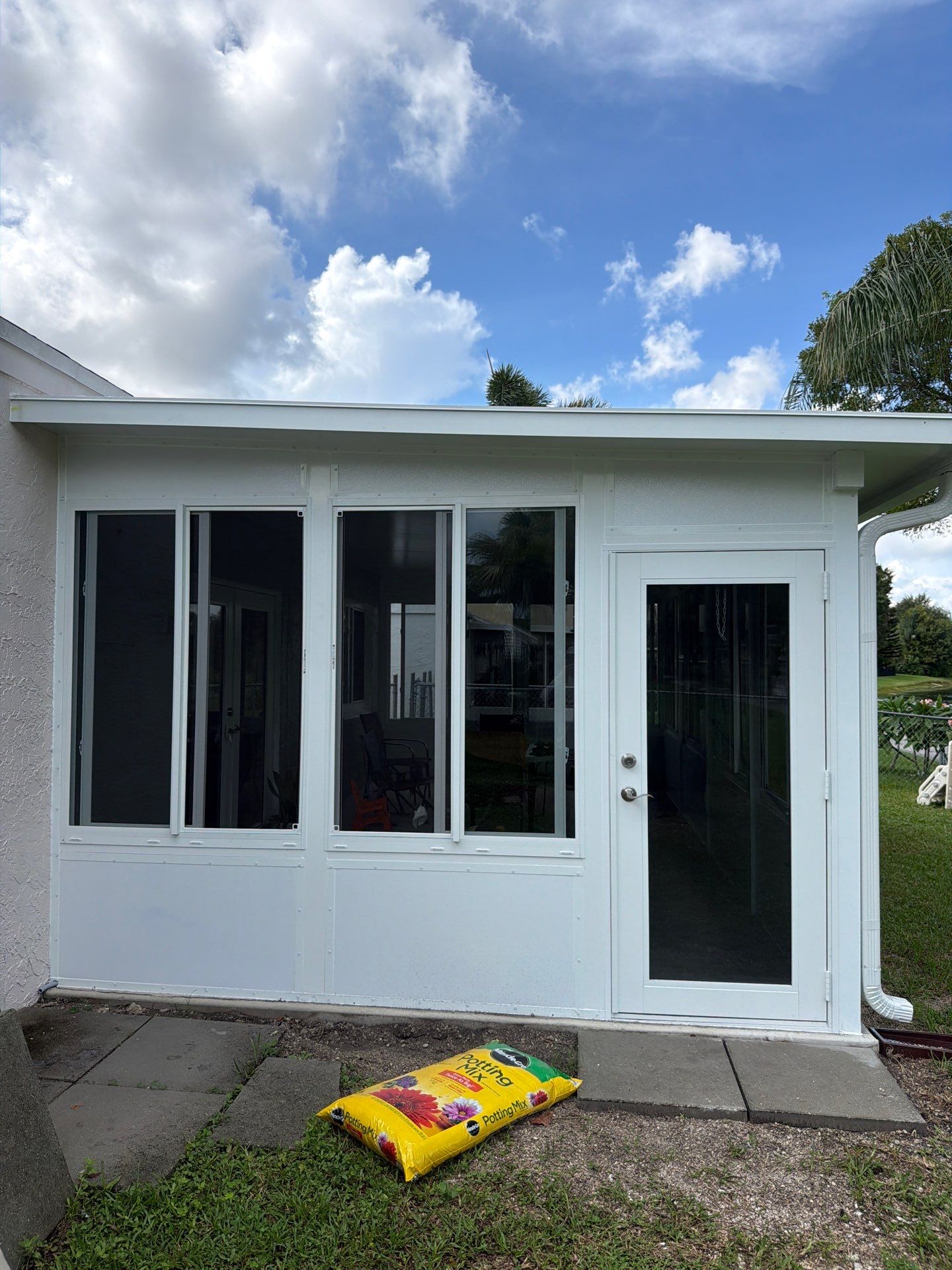 Custom Impact Sunroom With PGT Windows & Aluminum Insulated Roof in Boynton Beach by The Screen Depot, Inc