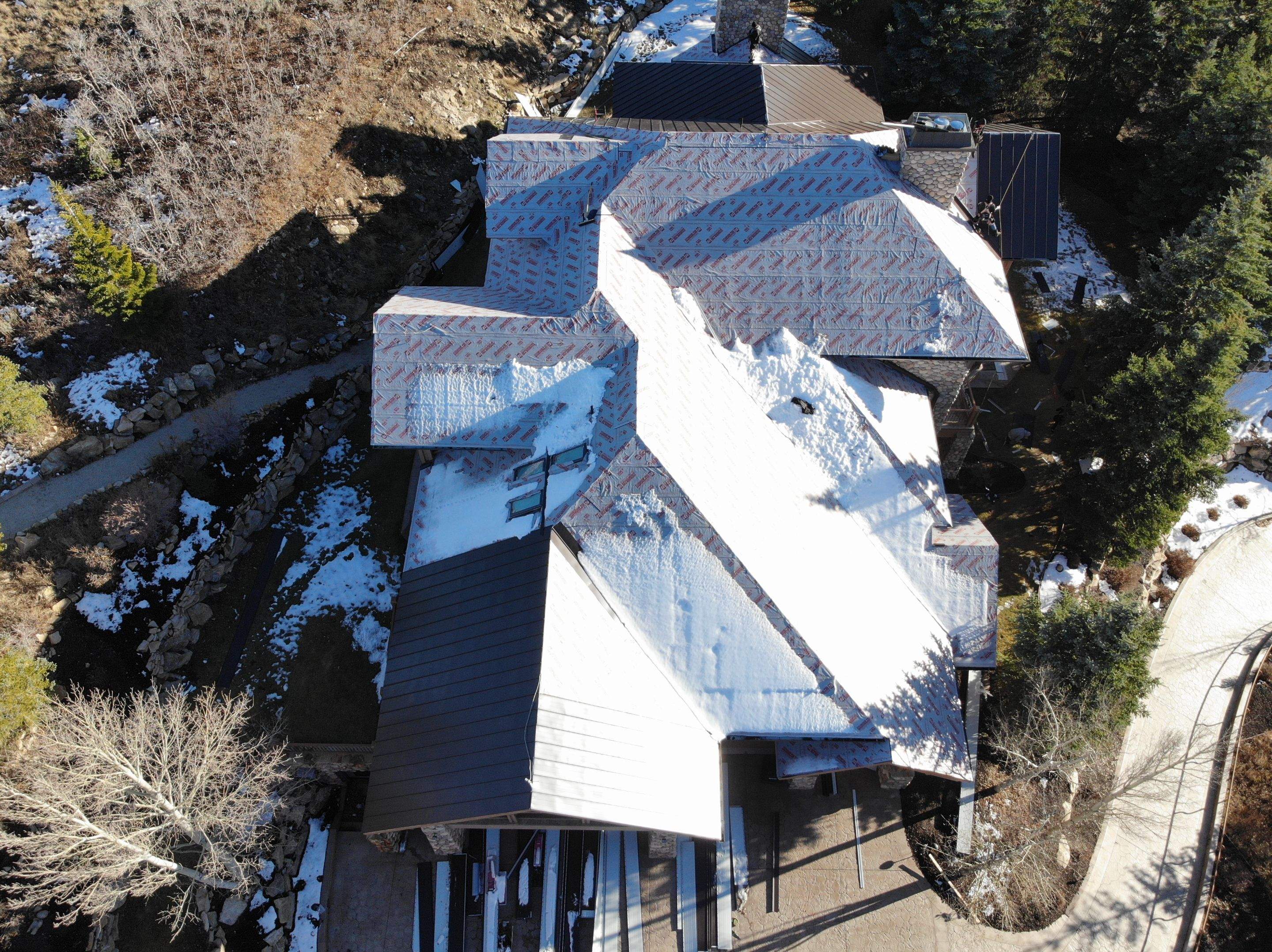 Standing Seam Metal Roof Replacement After Snow Damage by ASAP Roofing & Restoration