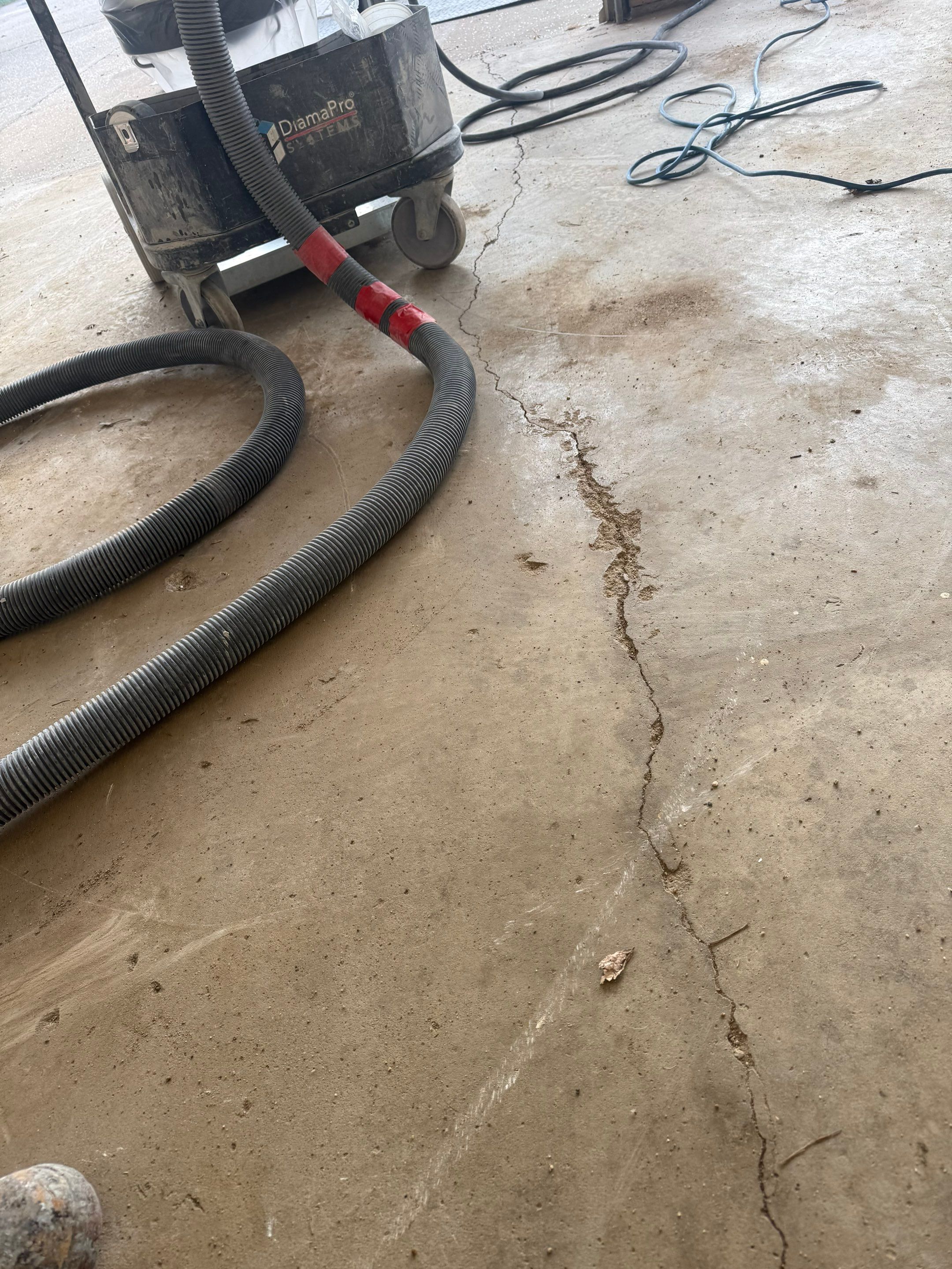 Feather Grey Garage Floor Coating and Crack Repair in Beresford by Select Painting, Coatings & Garage Cabinets