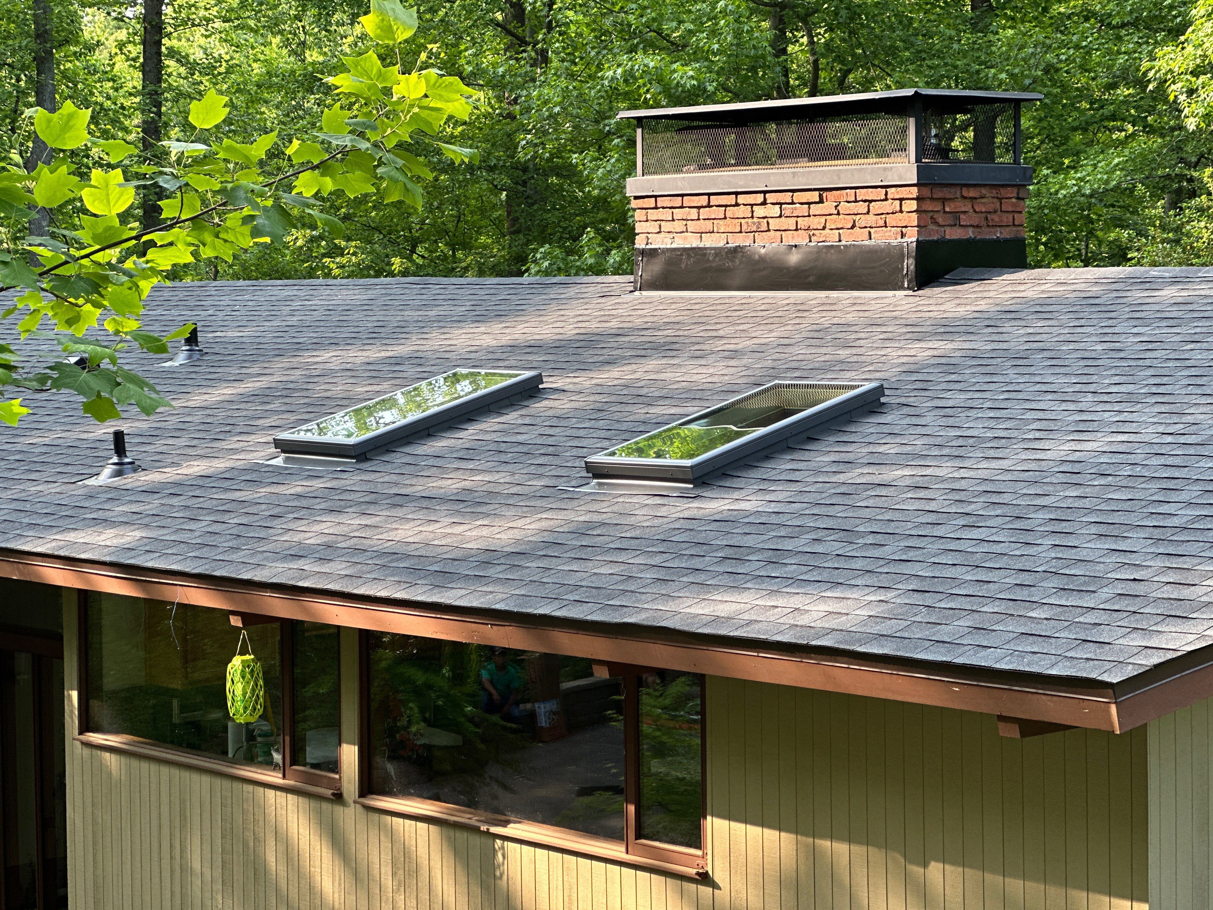 Acorn Deck House Roof Replacement + Skylight Addition by American Home Contractors