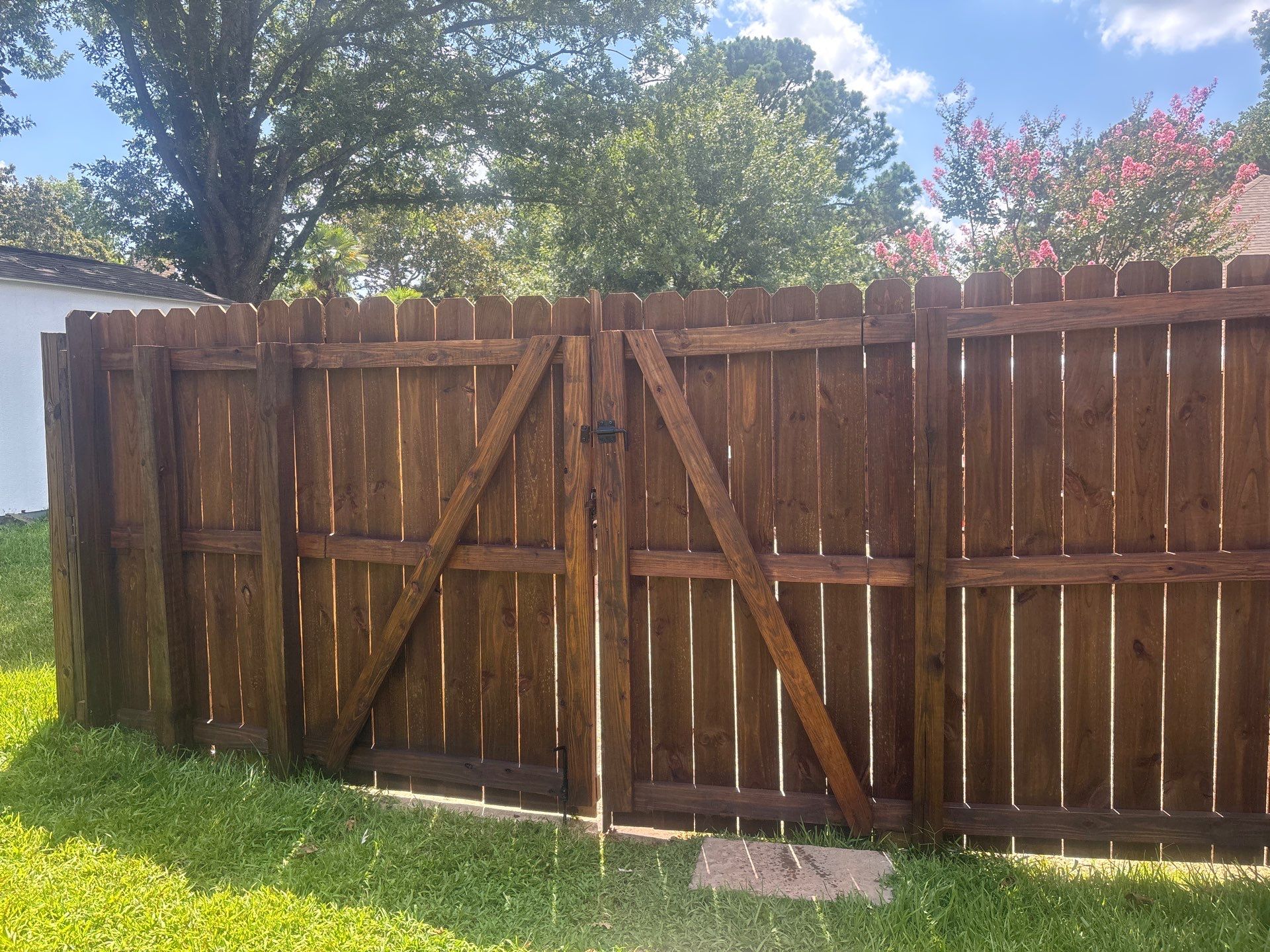 Project in TylerExterior Painting in Tyler, TX | White Brick Home, Varnished Fence & Shed Painting by Quality Coats Painting
