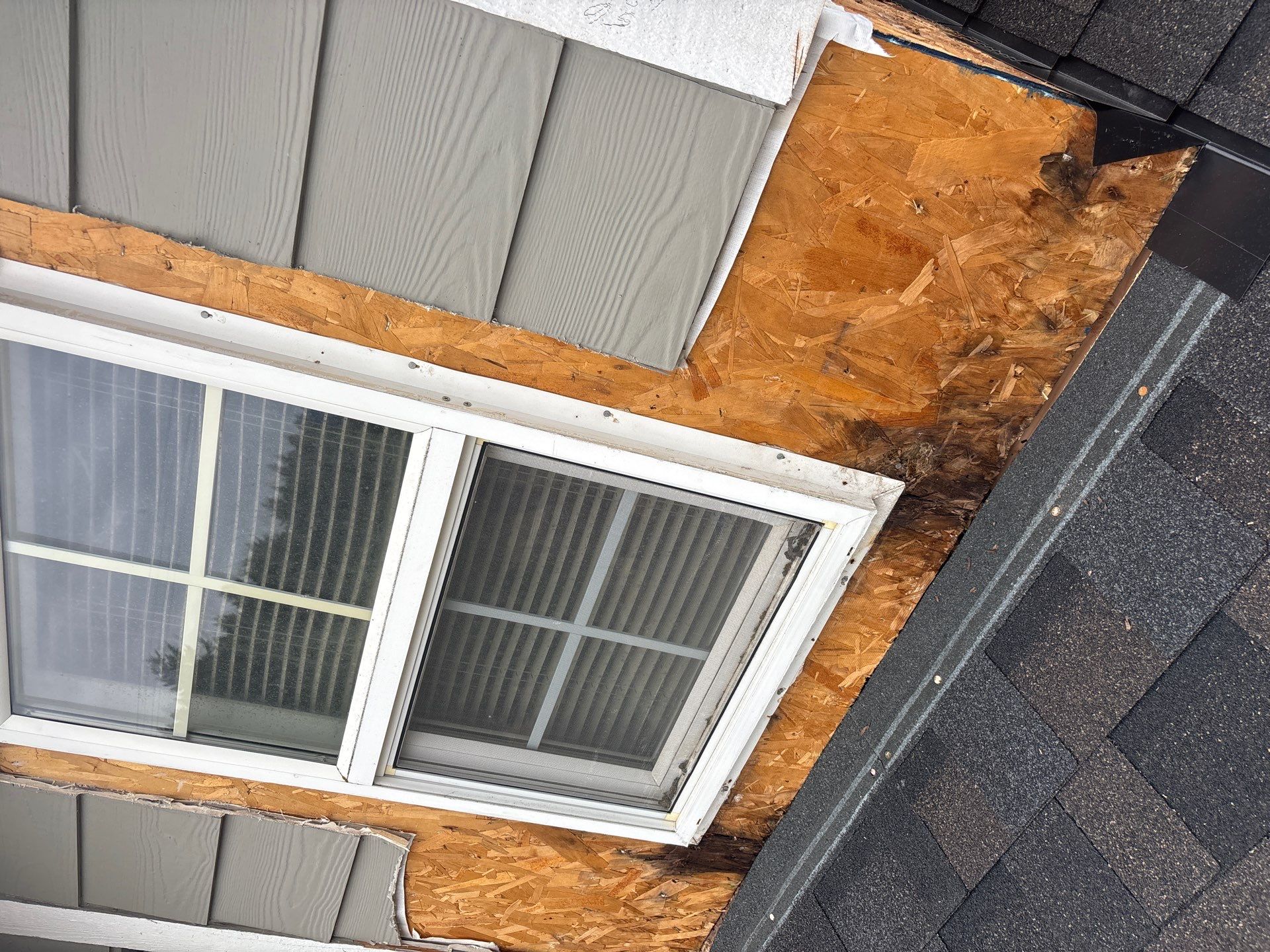 Glacier Roof Replacement with Metal Accents by Orezona Building & Roofing Company, Inc.