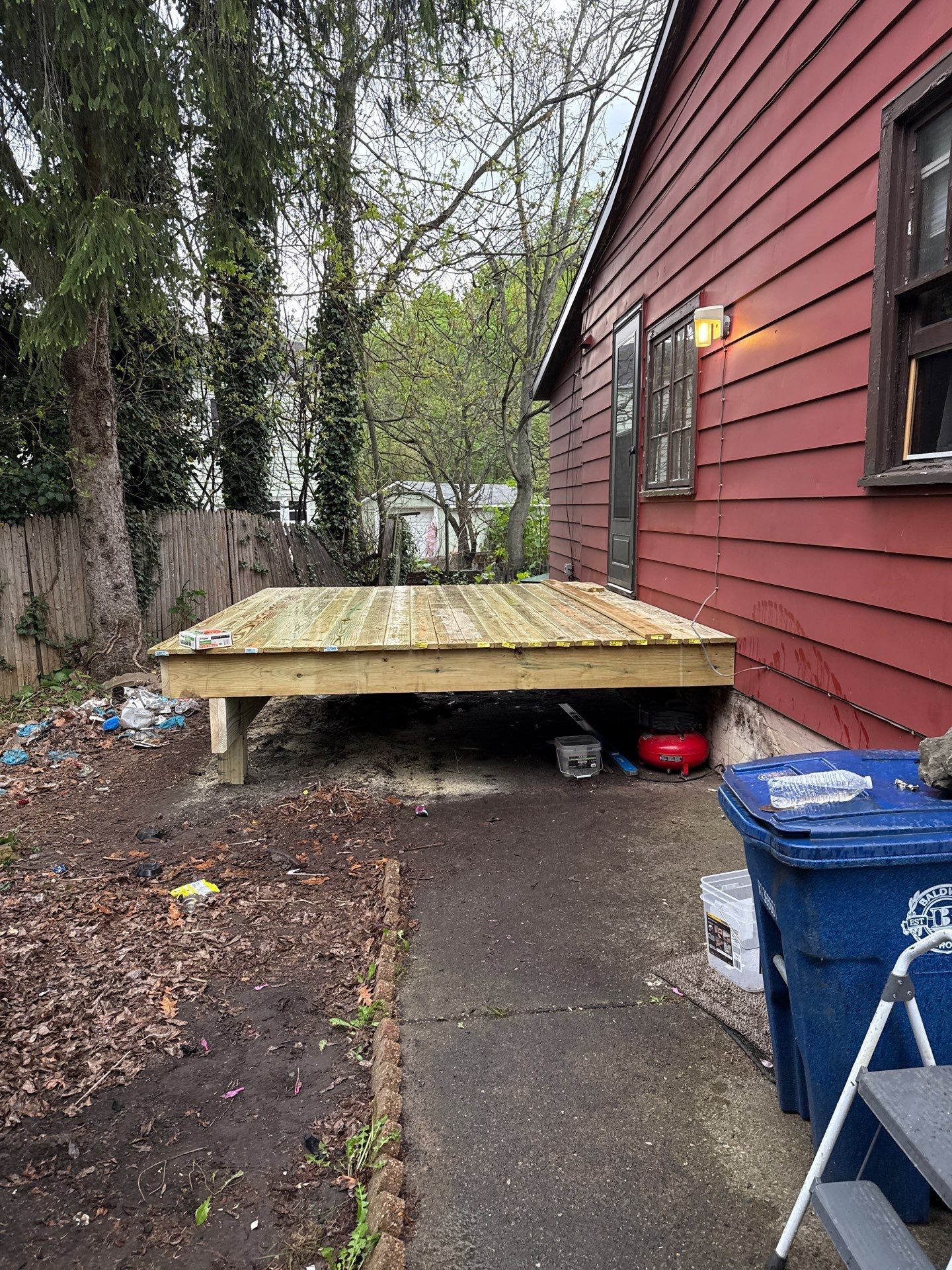 Roof sunspace deck  by Cousins Roofing Siding & Decks