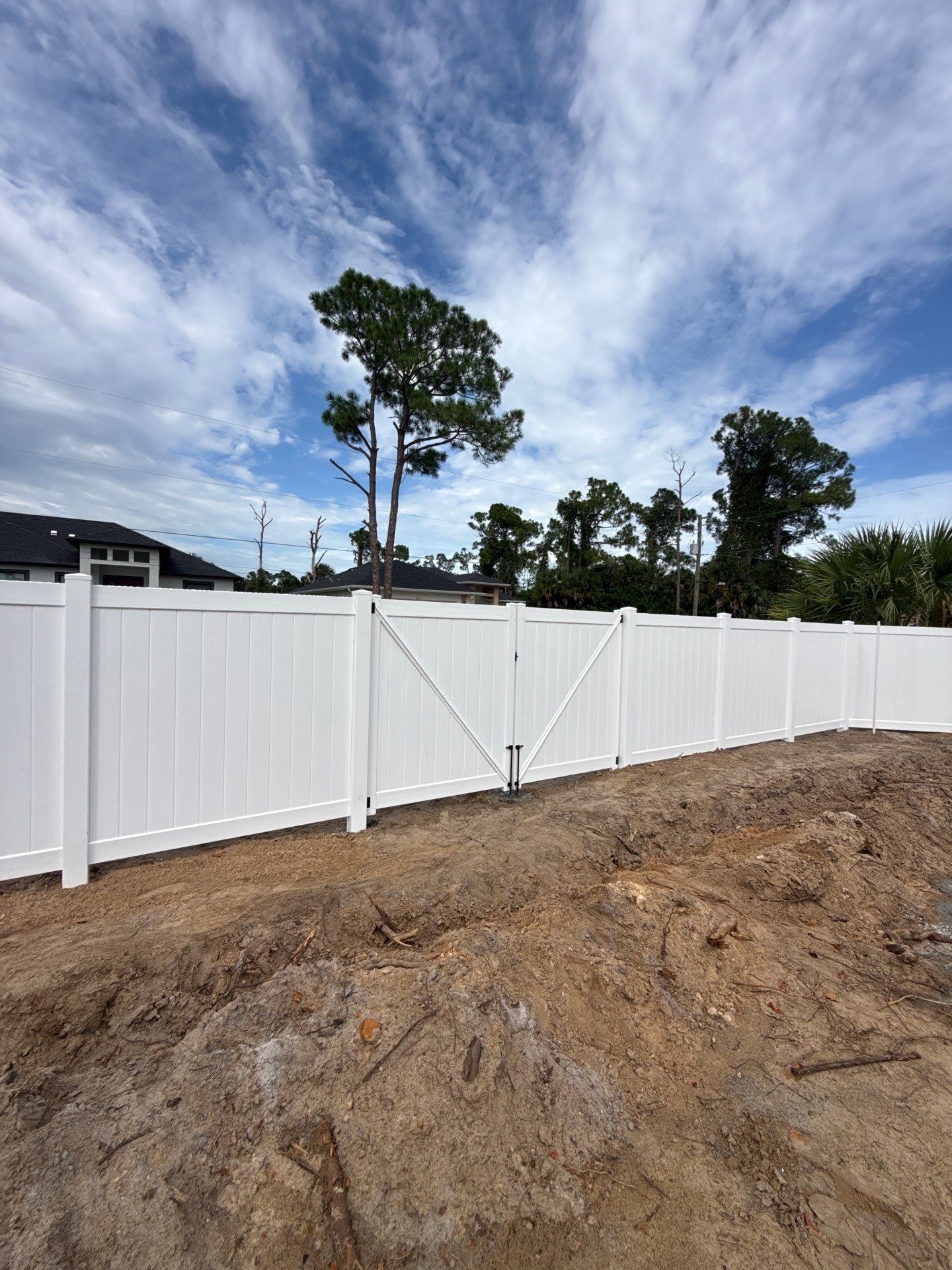 White Vinyl Privacy Fence Installation in North Port Florida by True Fence LLC