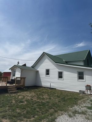 Standing-Seam Metal Roof and Vinyl Siding in Pender, NE by Crows Roofing LLC