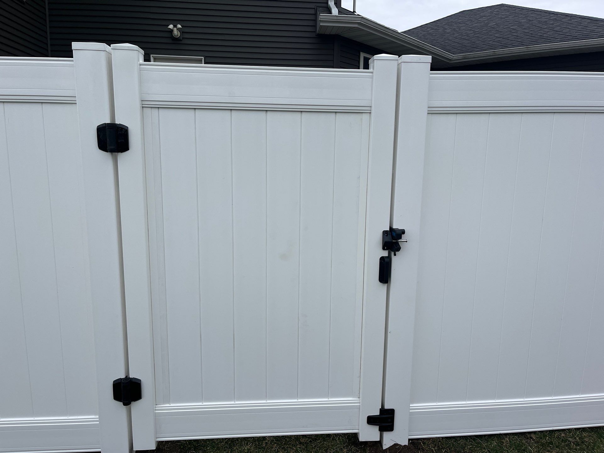 White Vinyl Privacy and Black Chain Link Fencing in Buckingham by Perfect Picket Fence and Stain