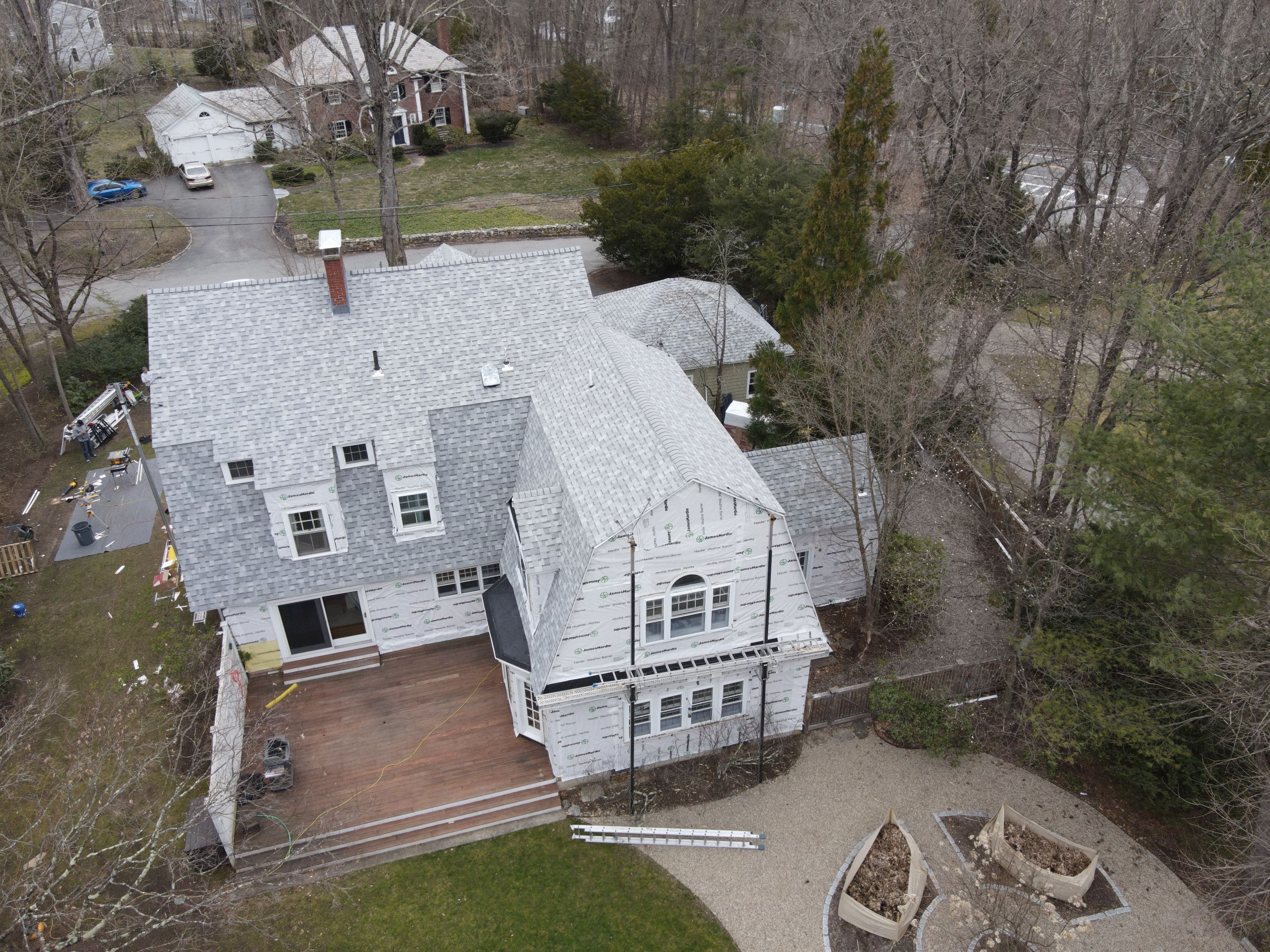 White cedar shingles and windows in Wayland, MA by UBrothers Construction