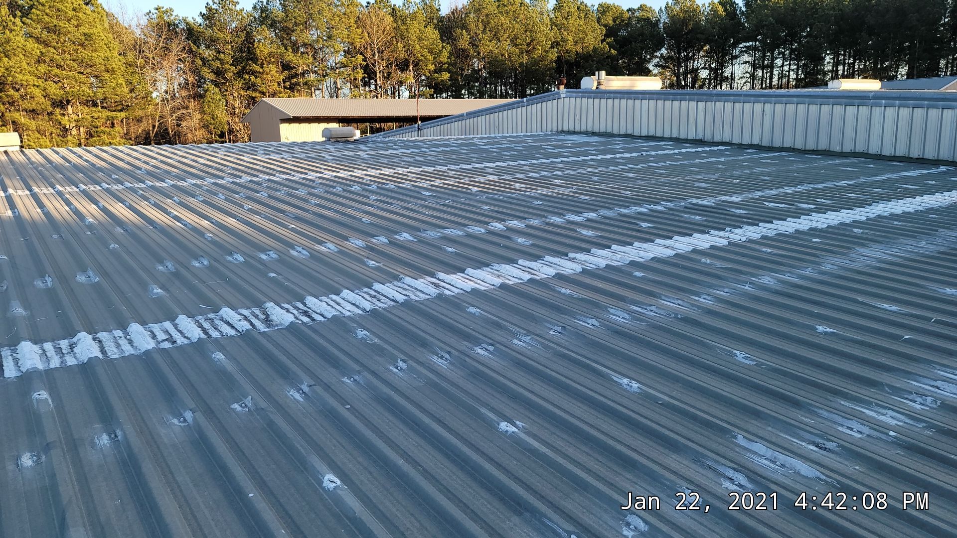 Commercial Roofing Installation using Aldocoat Coatings by Hostetler Roofing