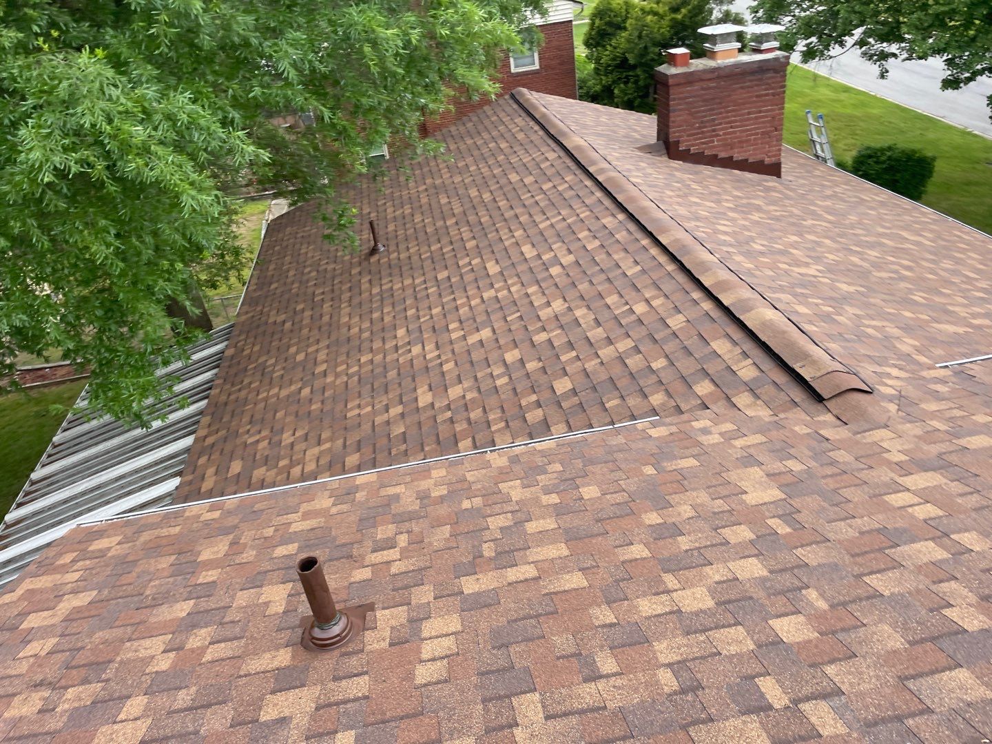 Roof Replacement - Owens Corning Dessert Rose by American Home Contractors