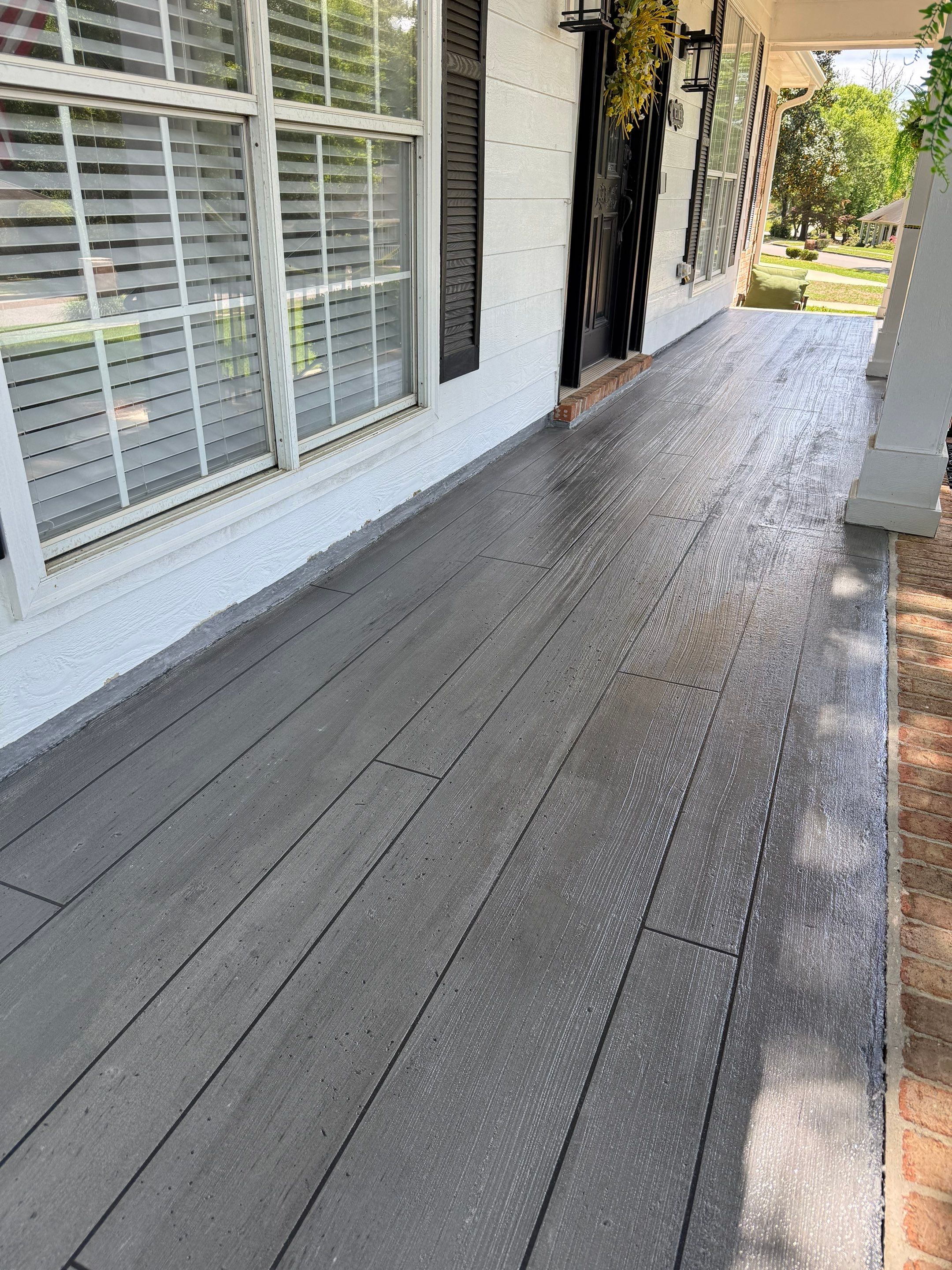 Wood-Grain Stenciled Concrete Porch Resurfacing in Mobile by Cornerstone Hard Surface Restoration 